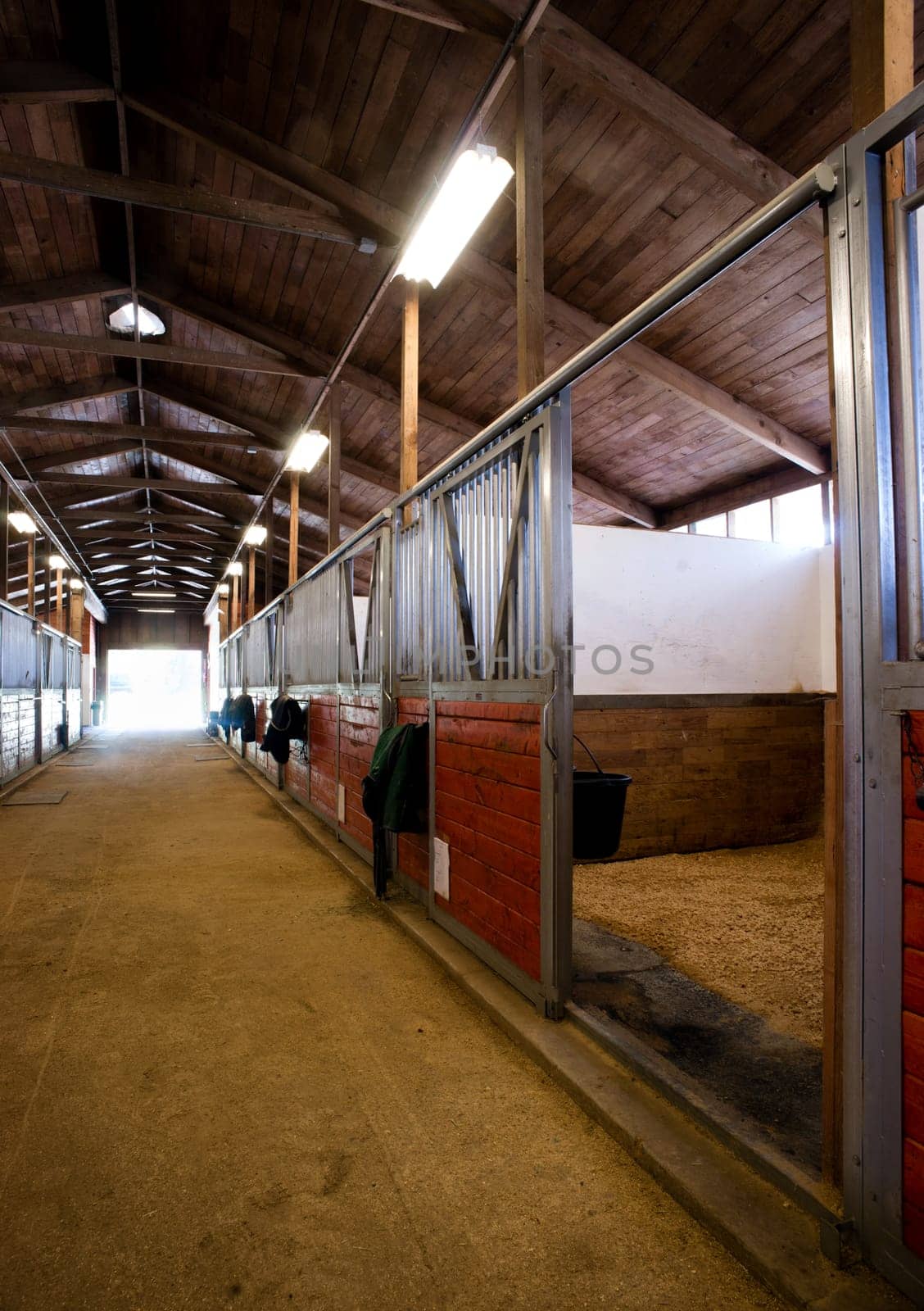 A saddle waits to be mounted on horses back at stables