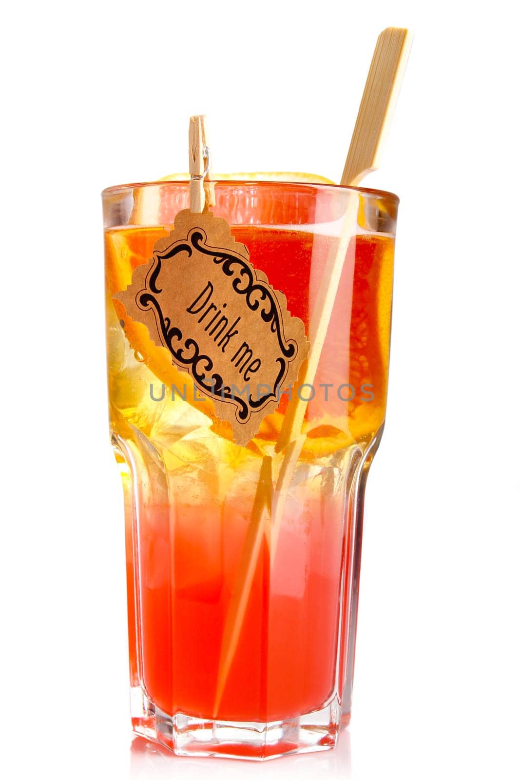 Red alcohol cocktail in glass with orange slice isolated on white