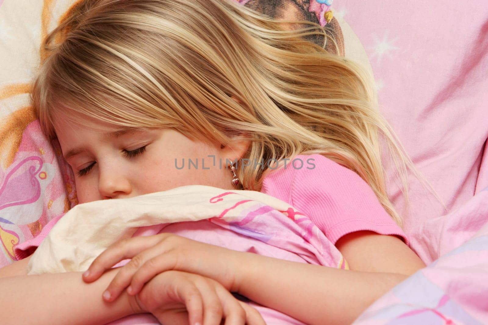 A little girl about to fall asleep, very drowsy