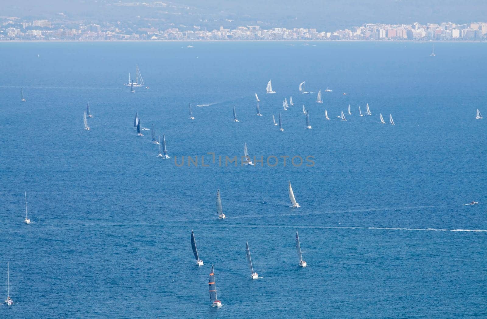 Sailing boat yacht or sailboat group regatta race on sea or ocean water. Panoramic view.
