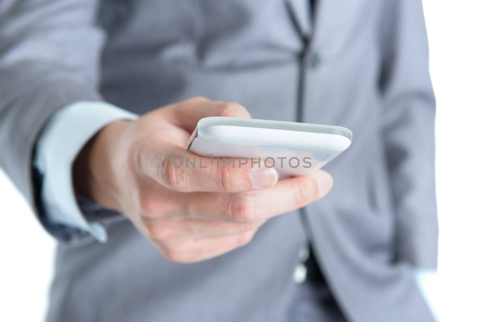 Close-up businessman hand using smart phone.