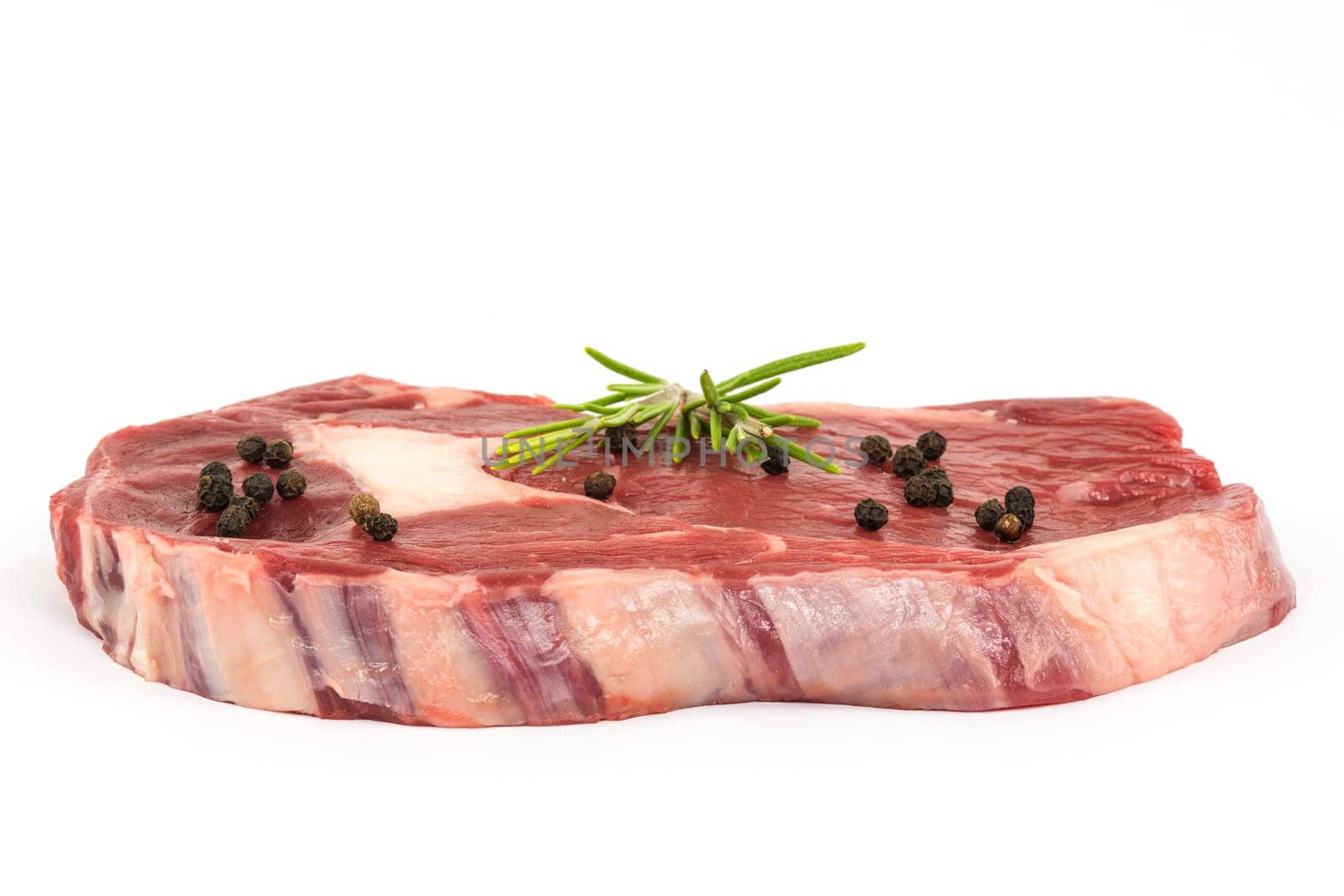 Steak raw,juicy Rib Eye Steak on a white background