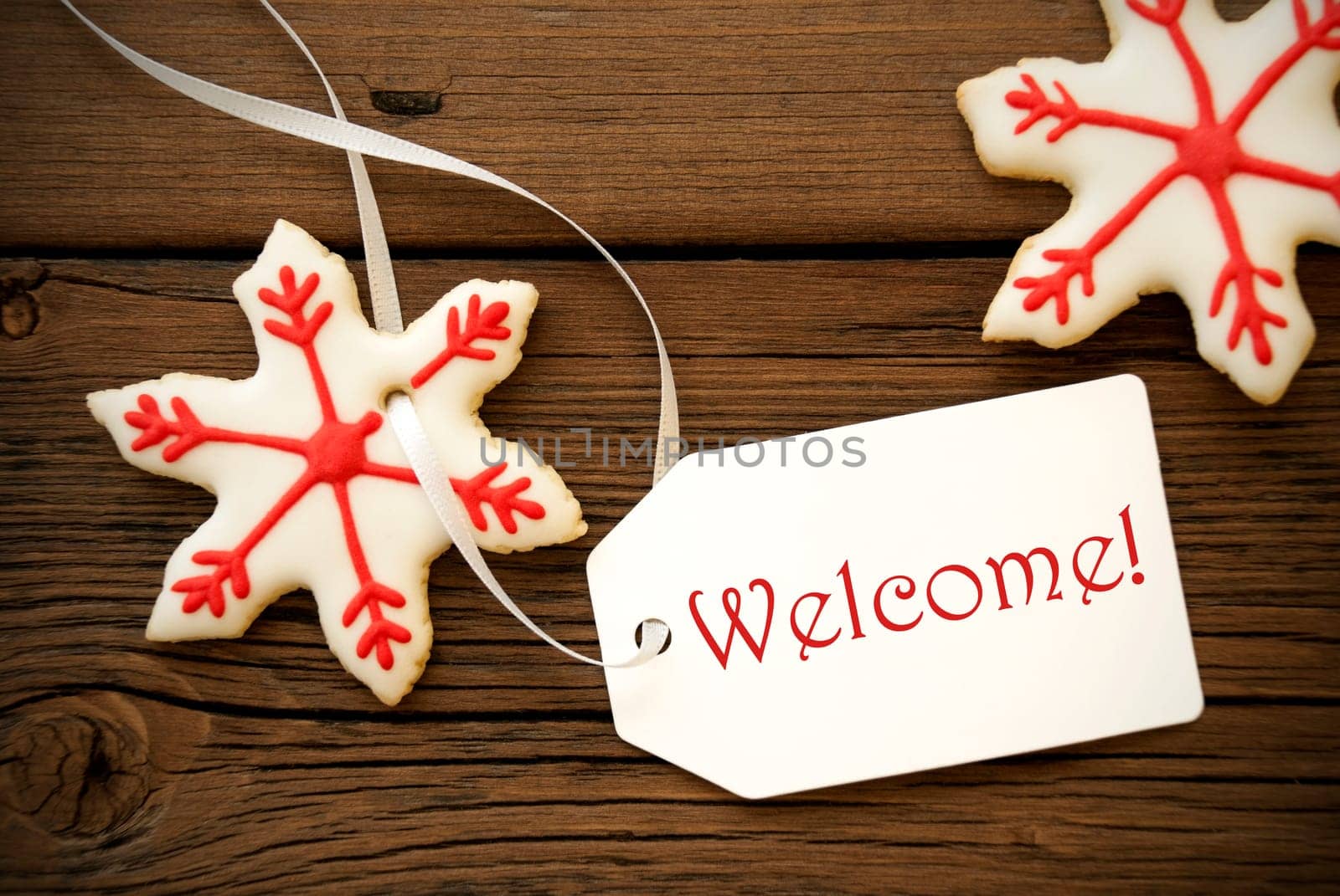 Red White Christmas Star Cookies with a Label on which stands Welcome