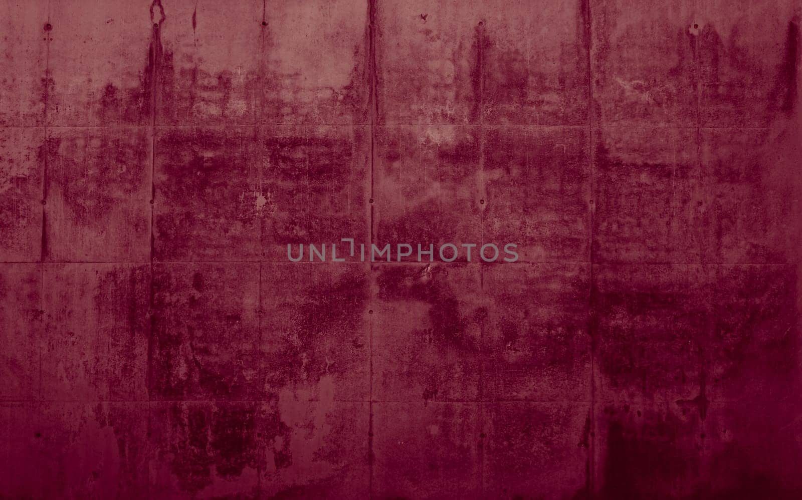 Old red stone wall as an uneven background