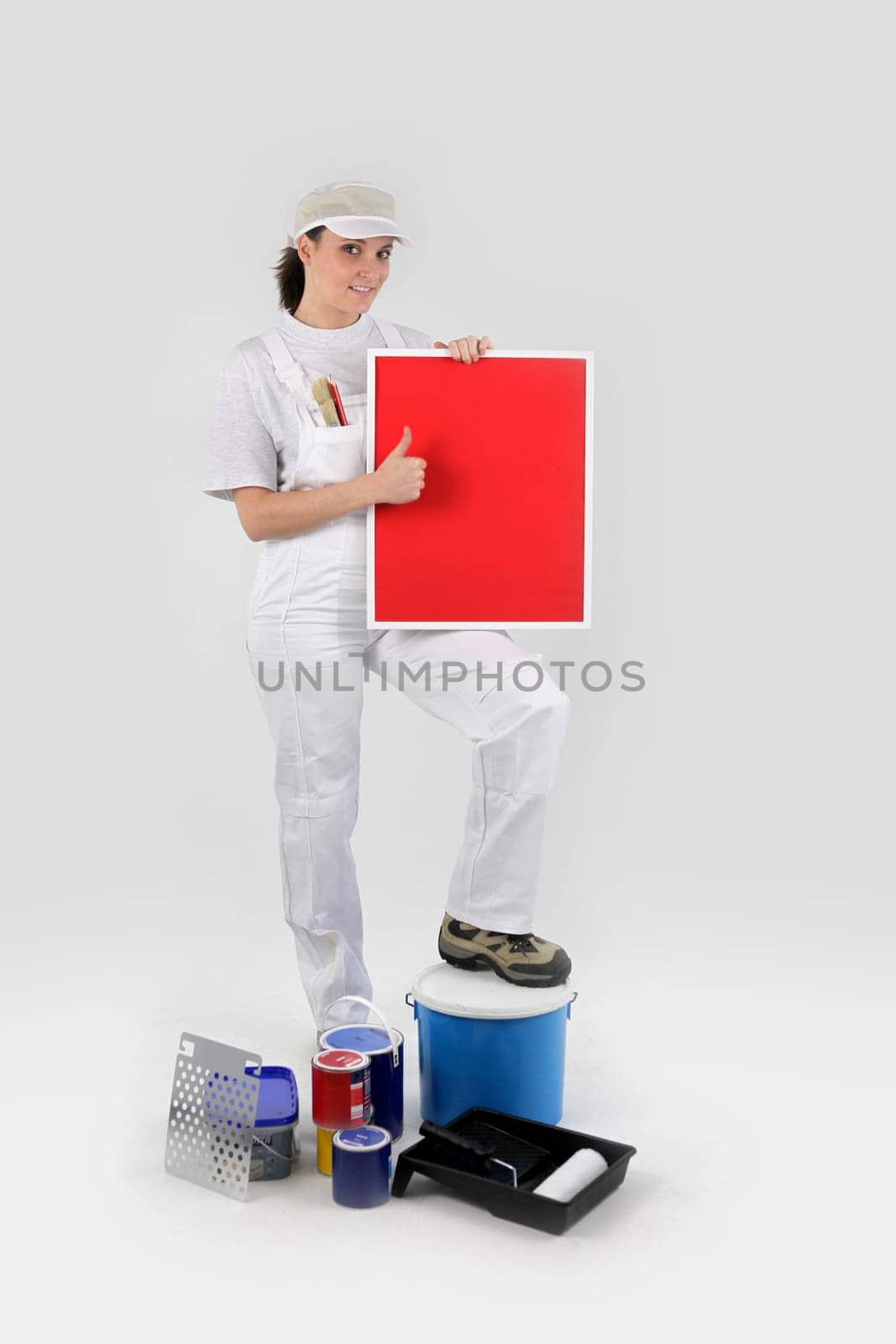 Female decorator giving the thumbs-up