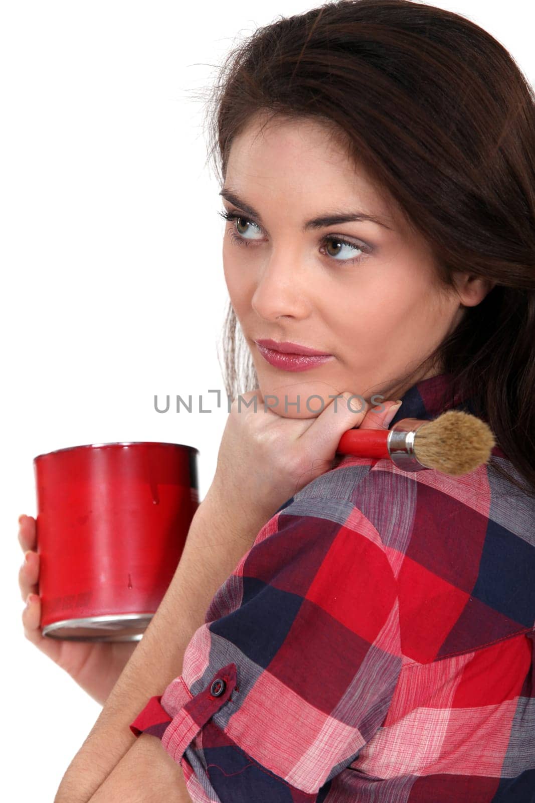 woman holding a brush and a paint can