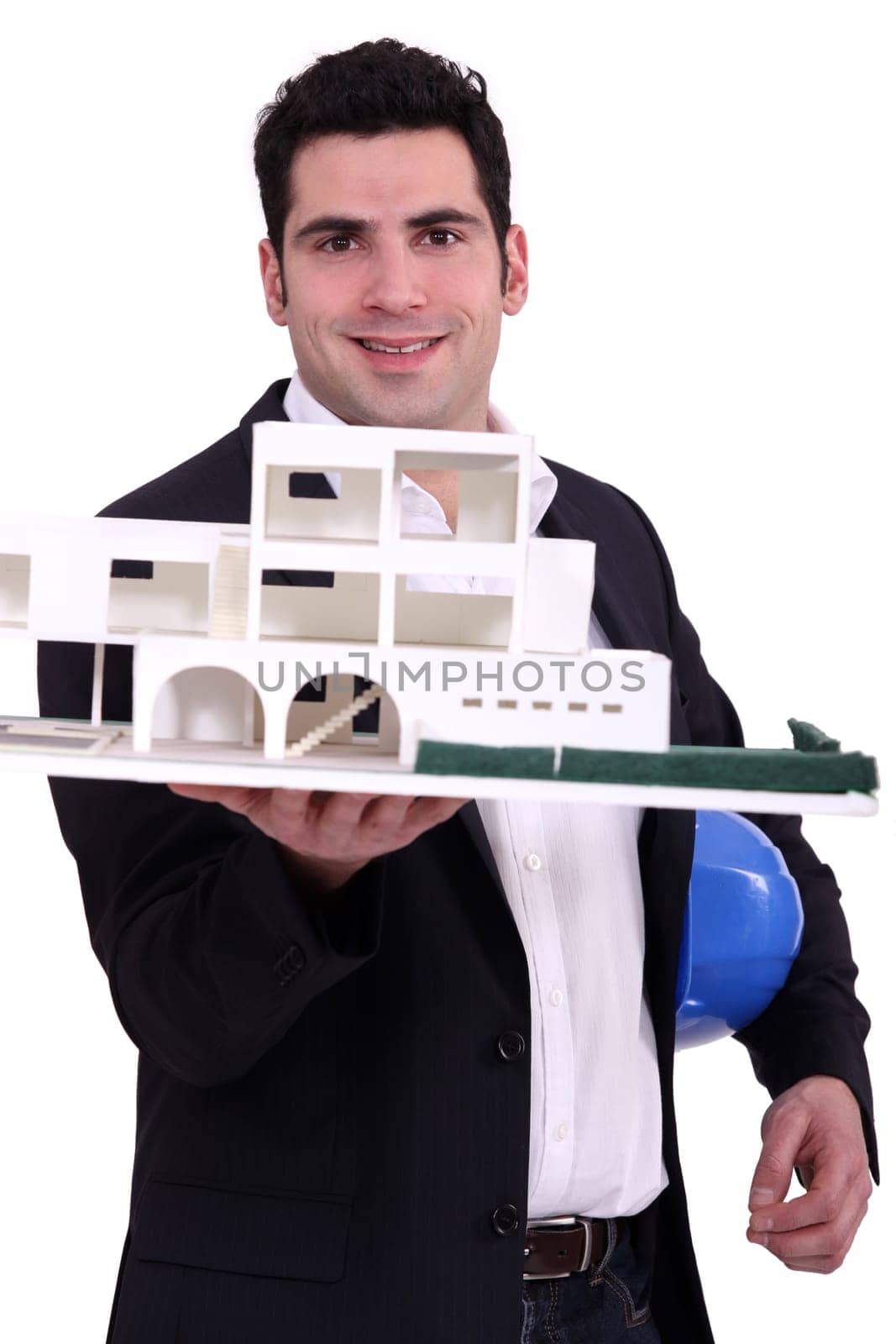 Architect holding up a building model