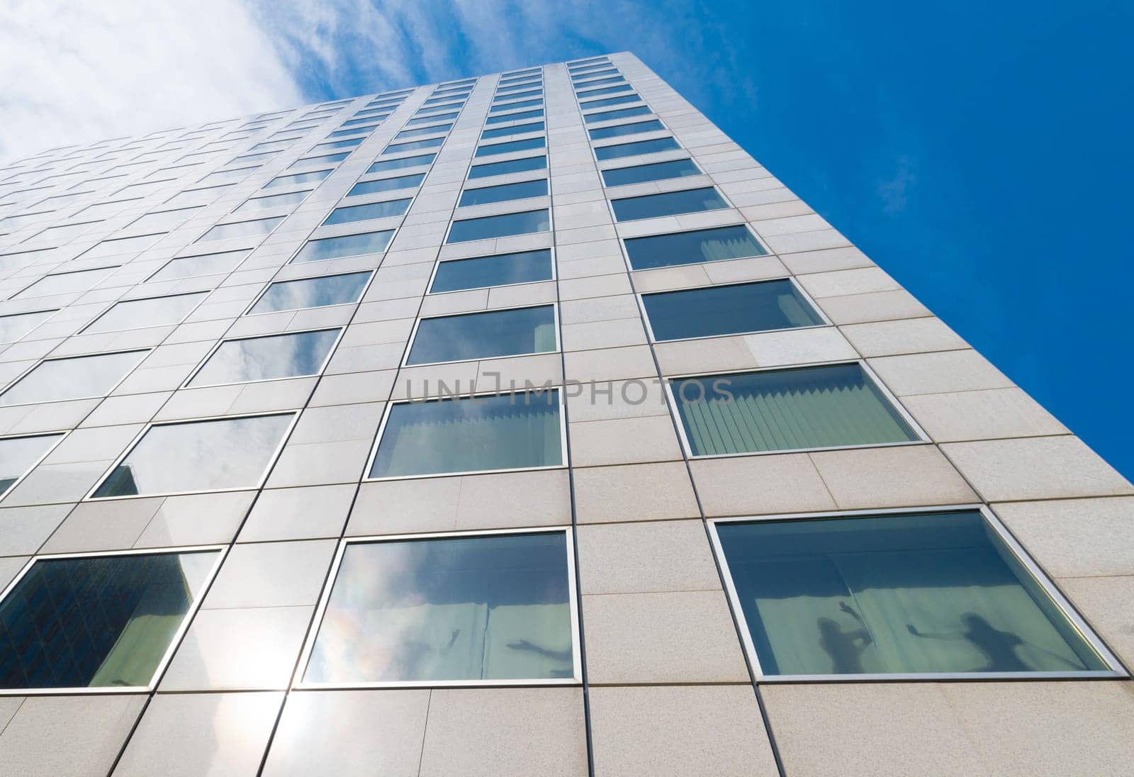 exterior of a modern skyscraper in the amsterdam business district