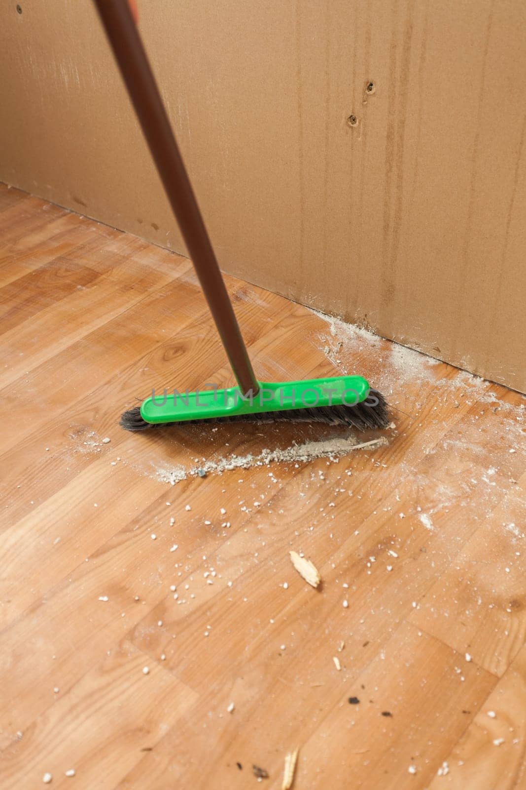 Photo of long swab cleaning dust and litter after renovation