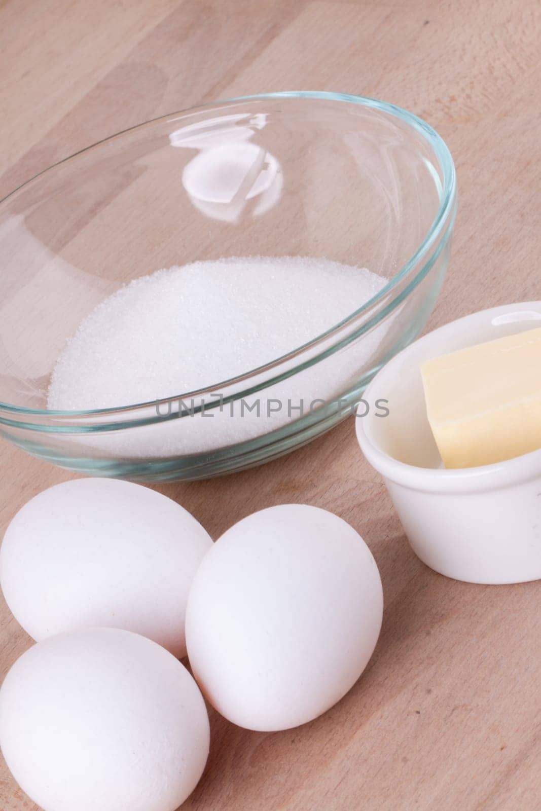 Baking ingredients in the kitchen me eggs,flour,butter and sugar to stir a dough and bake a cake