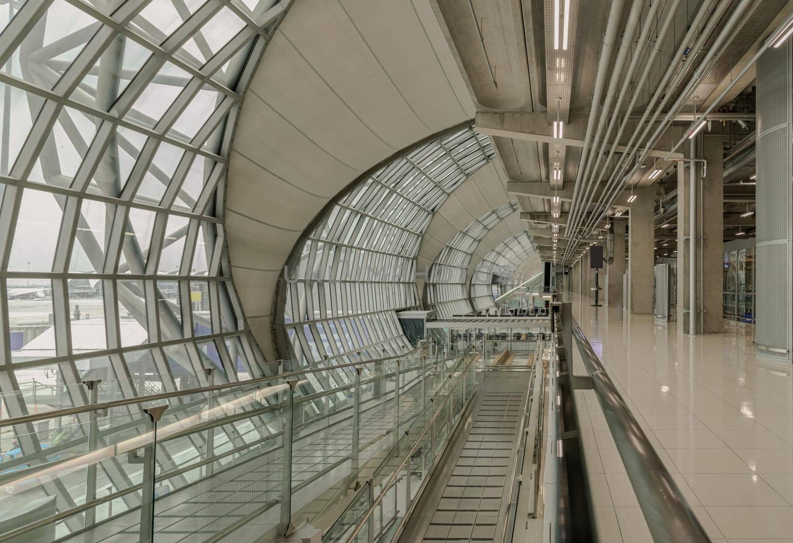 Bangkok, Thailand - Oct 05, 2023 - Modern architecture interior design of metal structure and glass at Suvarnabhumi Departure terminal. Departure area of Suvarnabhumi international airport (BKK). Space for text, Selective focus.