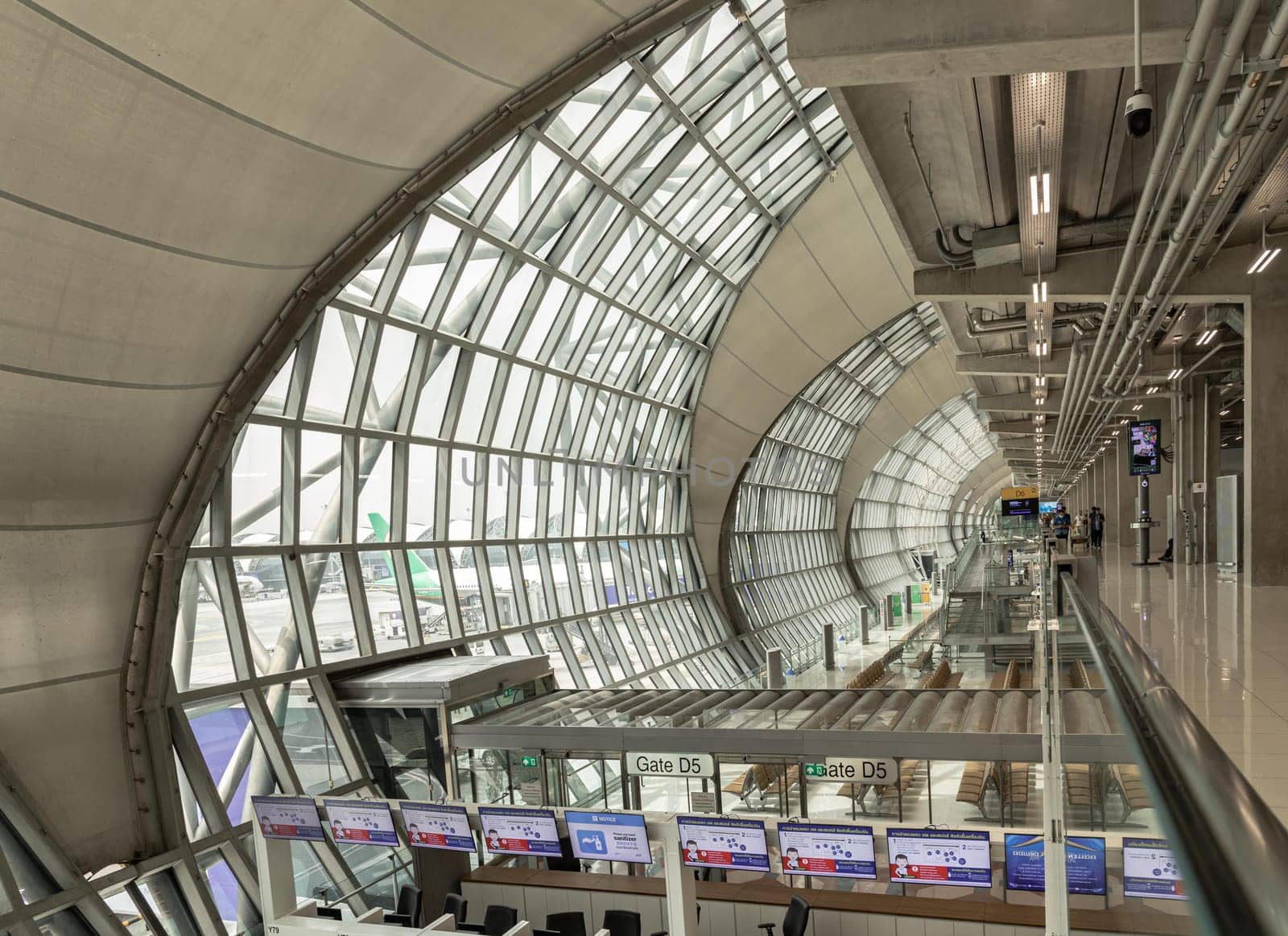Bangkok, Thailand - Oct 05, 2023 - Modern architecture interior design of metal structure and glass at Suvarnabhumi Departure terminal. Departure area of Suvarnabhumi international airport (BKK). Space for text, Selective focus.