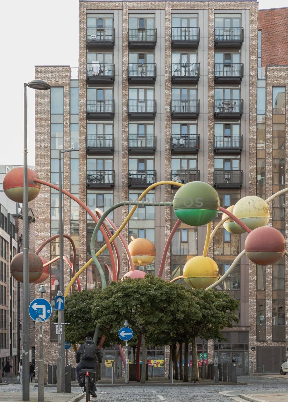 Liverpool, UK - Oct 09, 2023 - The penelope sculpture at Wolstenholme square's famous at Gradwell Street, Abstract of different coloured spheres at the end of poles twisting at different heights and directions, Merseyside, Space for text, Selective focus.