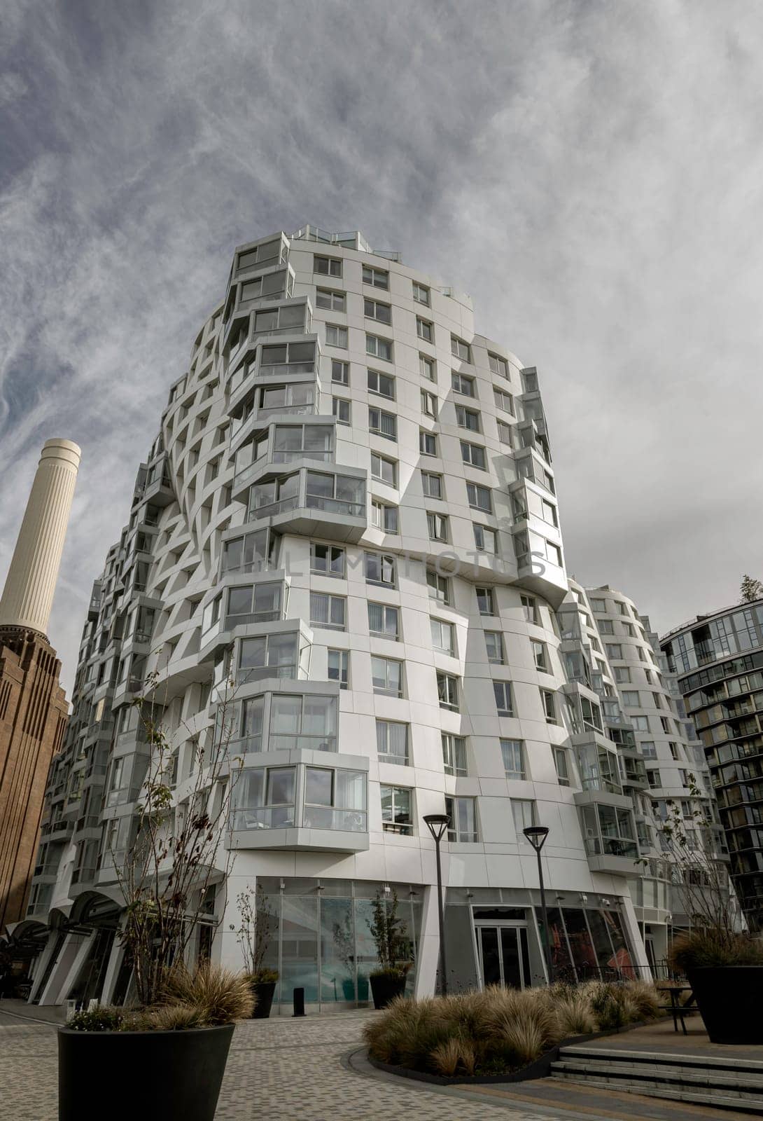 London, UK - Oct 16, 2023 - Facade Residential luxury apartment buildings at Battersea near to Battersea Power Station. Modern apartment battersea buildings complex with balconies and architectural structure, Design urban geometry.