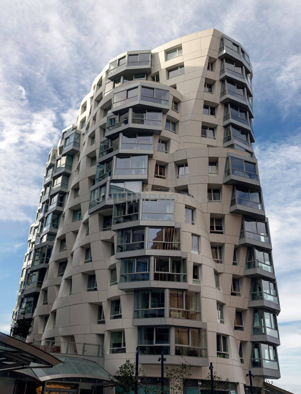 London, UK - Oct 16, 2023 - Facade Residential luxury apartment buildings at Battersea near to Battersea Power Station. Modern apartment battersea buildings complex with balconies and architectural structure, Design urban geometry.