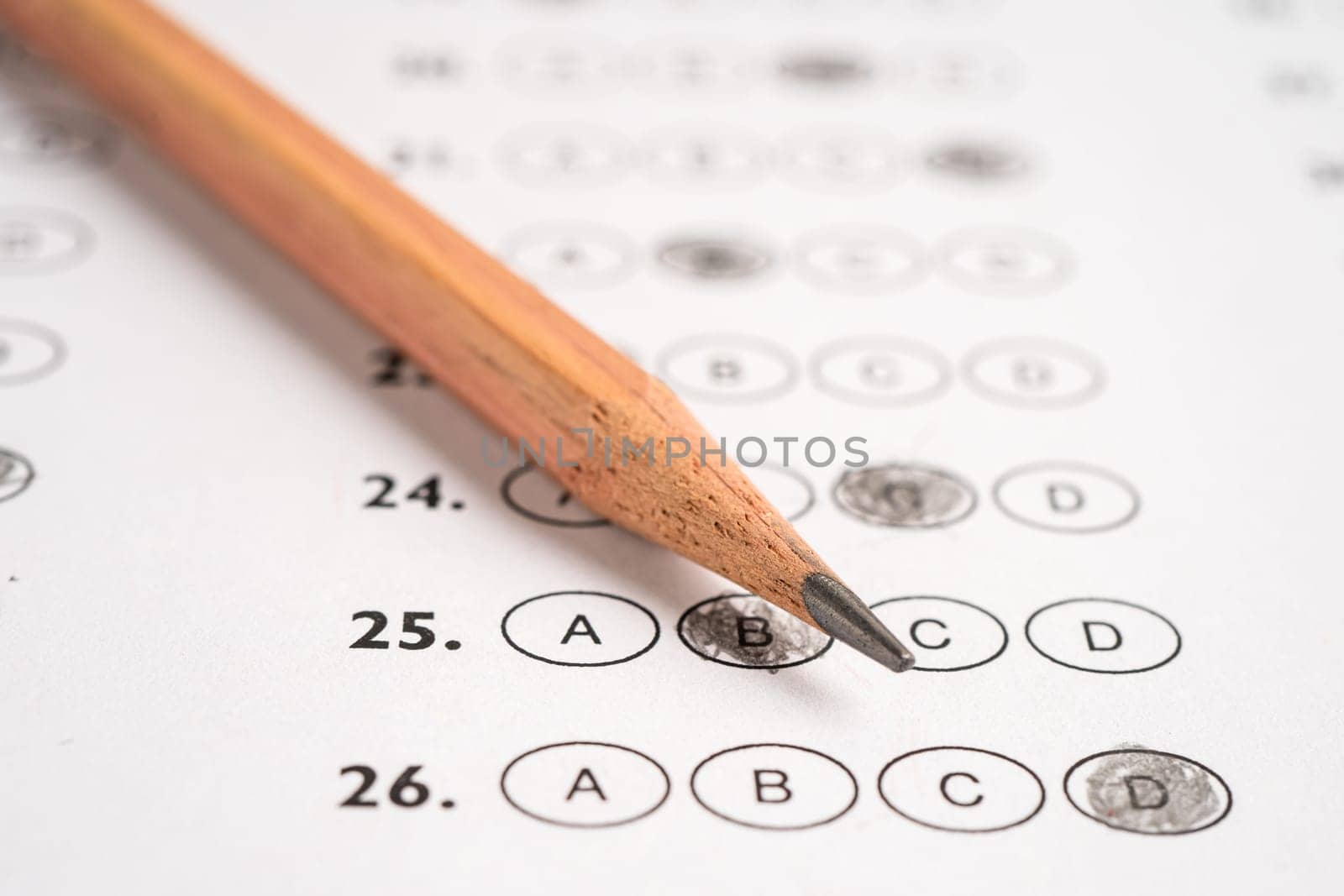 Answer sheets with pencil drawing fill to select choice, education concept.