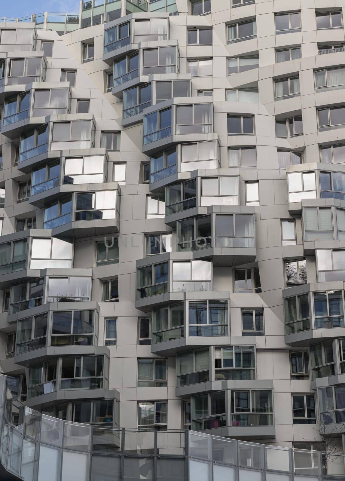 London, UK - Oct 16, 2023 - Geometric design on a modern building complex with repeating structure. Exterior architecture of modern building, Space for text, Selective focus.