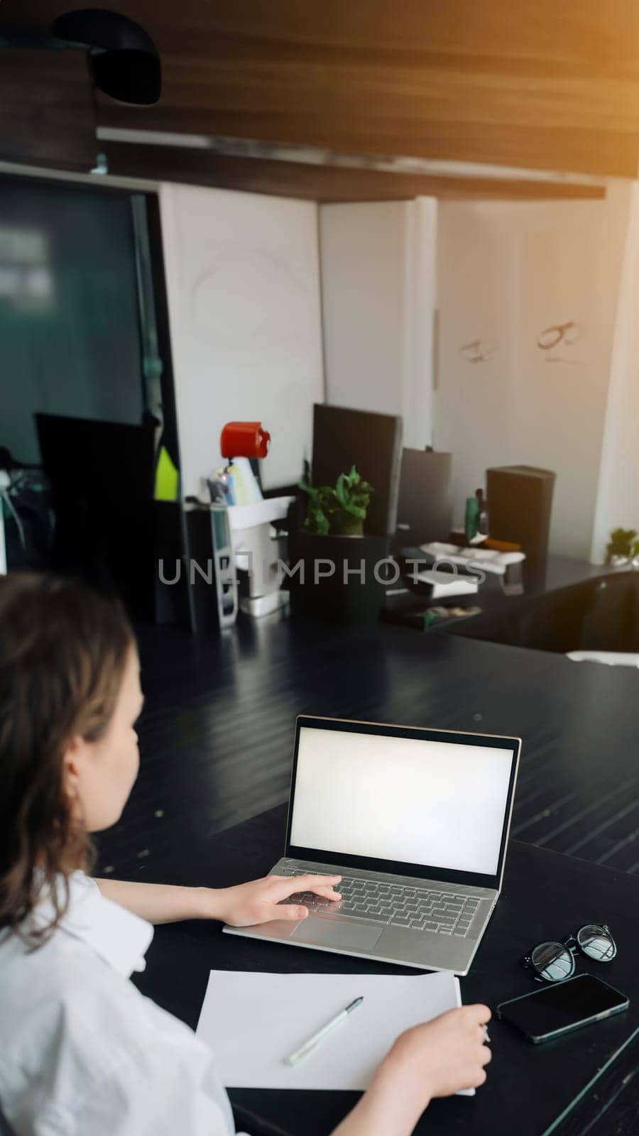 Young woman using laptop computer at home. Business woman working in office. Young Woman Navigates a Versatile Lifestyle: Freelance, Student, E-Learning, Technology, and Online Shopping
