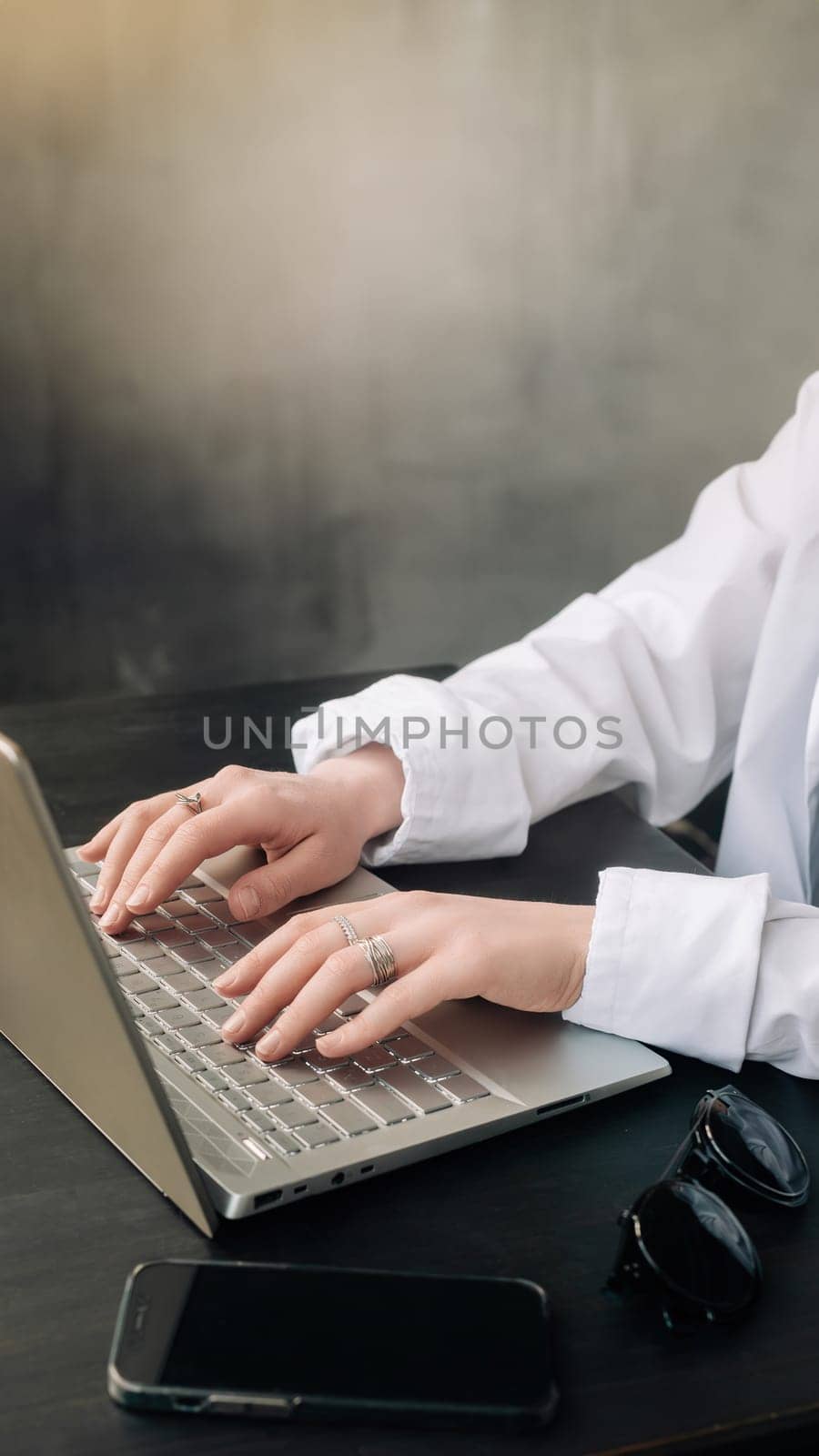 Professional Businesswoman Analyzing Strategy in Office. Laptop and Workroom Scene. Business woman professional work in the office, analyzing business strategy, woman use a laptop in the workroom