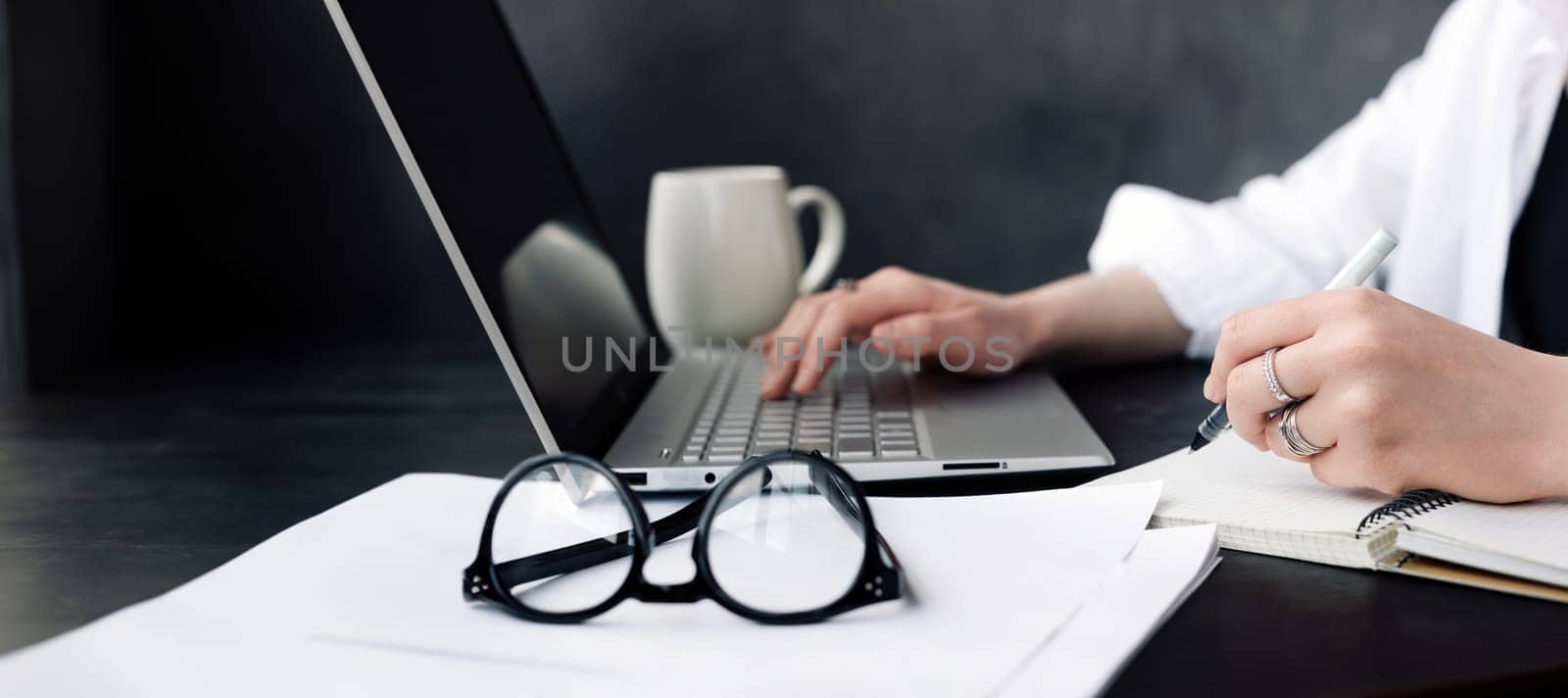 Focused Professional. Woman Journalist or Businesswoman at Work in Office. Strategic Planning. Woman Professional in Office Environment. Dedicated Journalist in Action. Woman at Office Workspace.