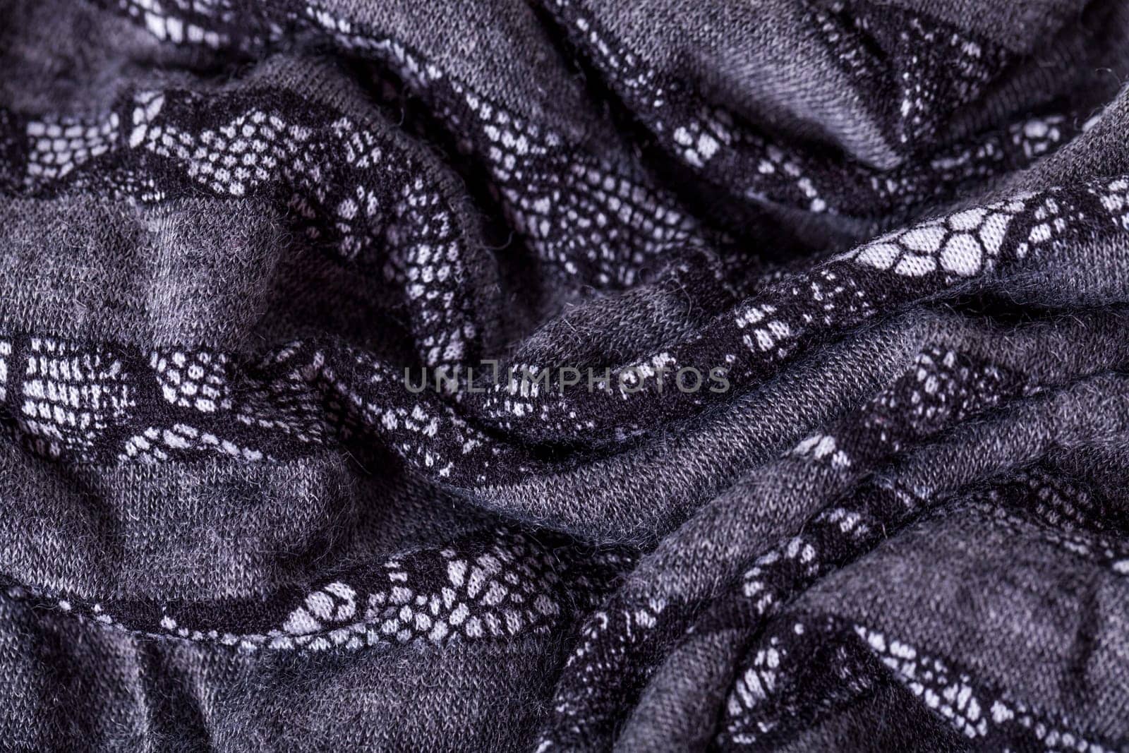 grey antrazite coloured fabric made of wool cotton with lace texture as close-up