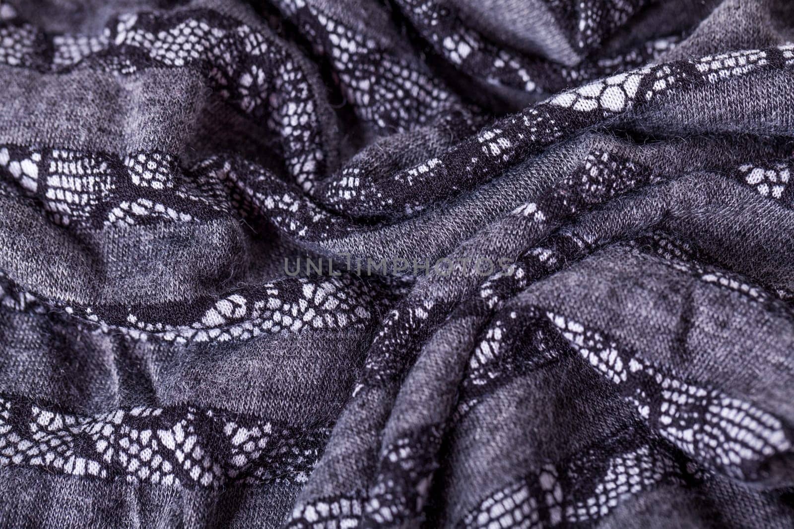 grey antrazite coloured fabric made of wool cotton with lace texture as close-up