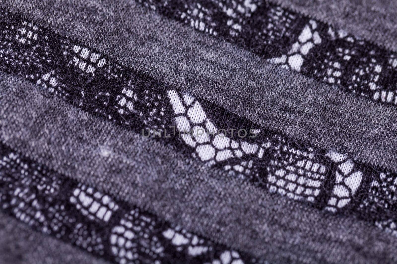 grey antrazite coloured fabric made of wool cotton with lace texture as close-up