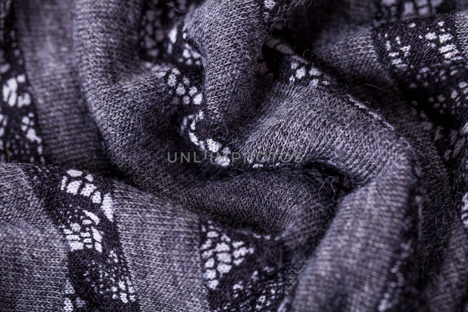 grey antrazite coloured fabric made of wool cotton with lace texture as close-up