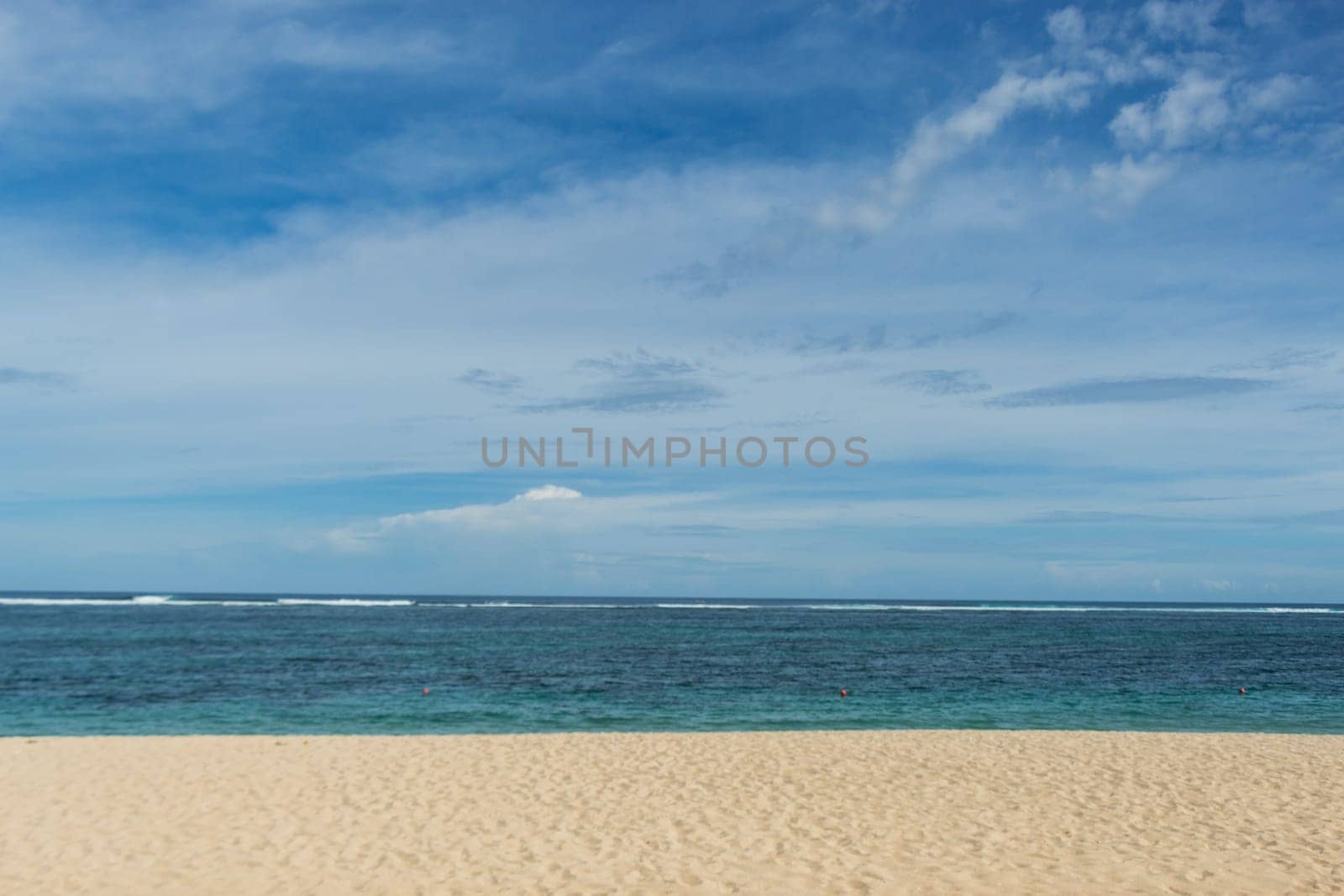 Beautiful secluded sandy beach in the Caribbean with white sand and blue sky as in paradise