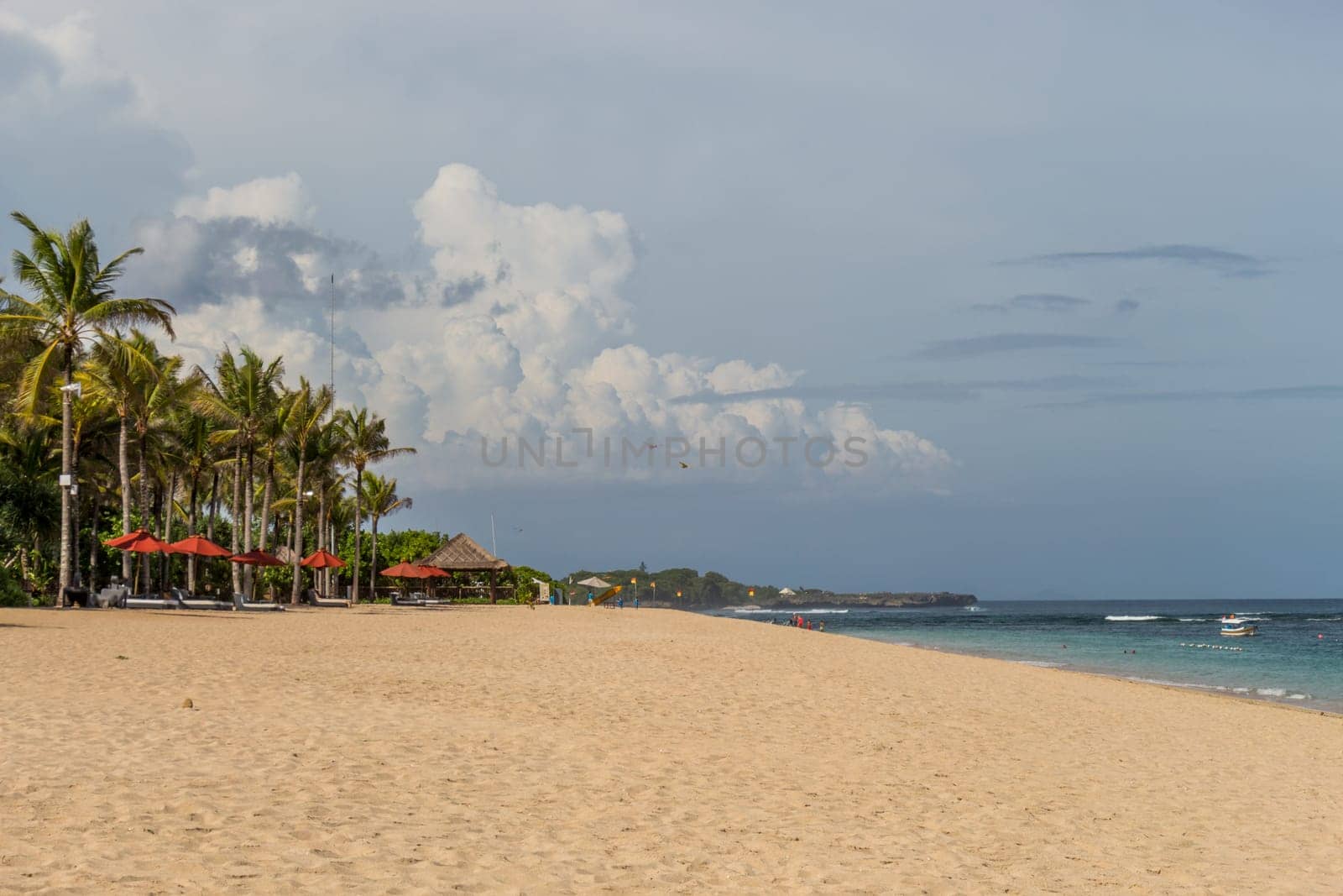Beautiful secluded sandy beach in the Caribbean with white sand and blue sky as in paradise