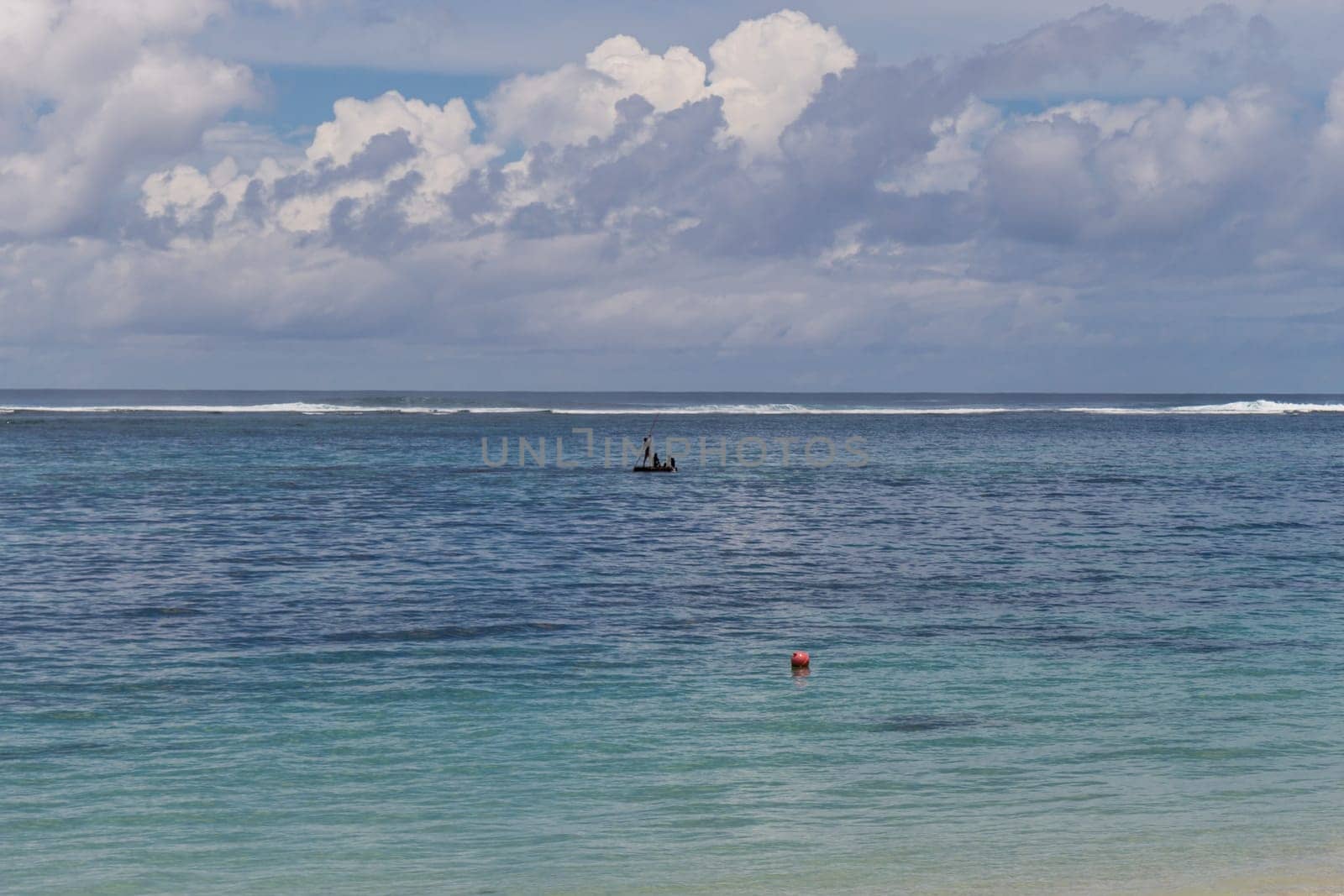 Beautiful secluded sandy beach in the Caribbean with white sand and blue sky as in paradise