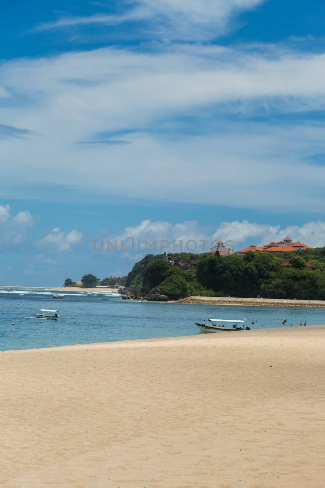 Beautiful secluded sandy beach in the Caribbean with white sand and blue sky as in paradise