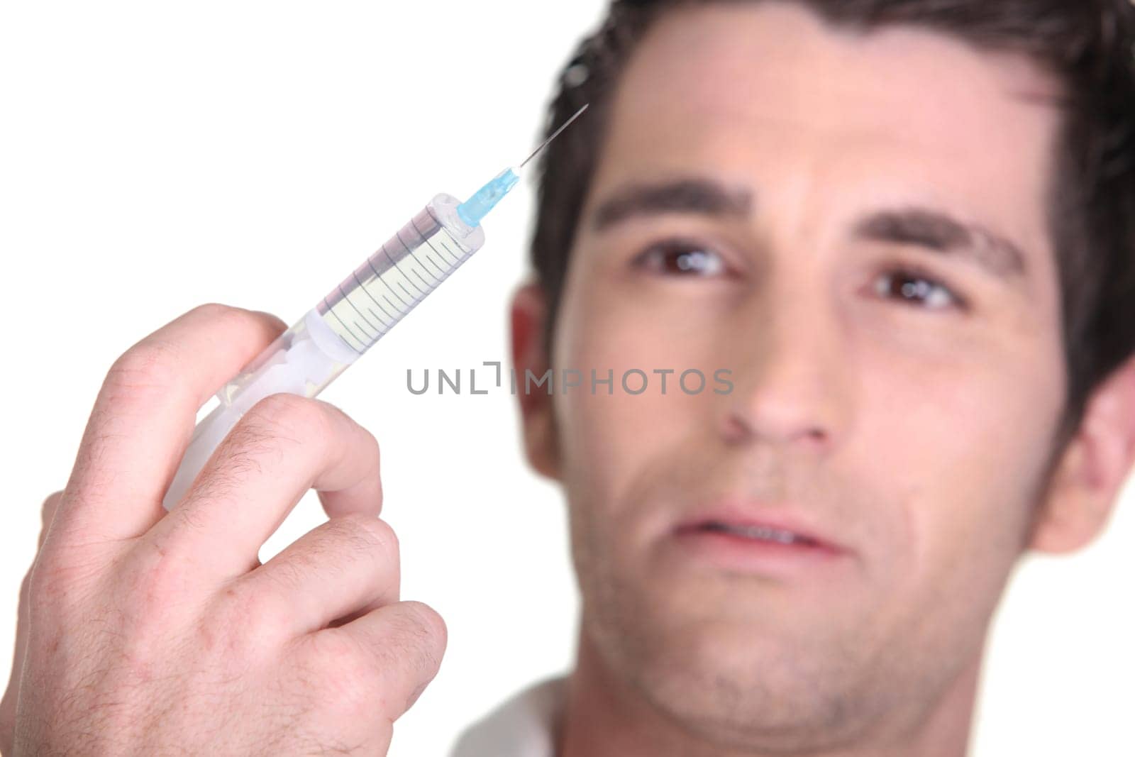 Man with syringe in hand