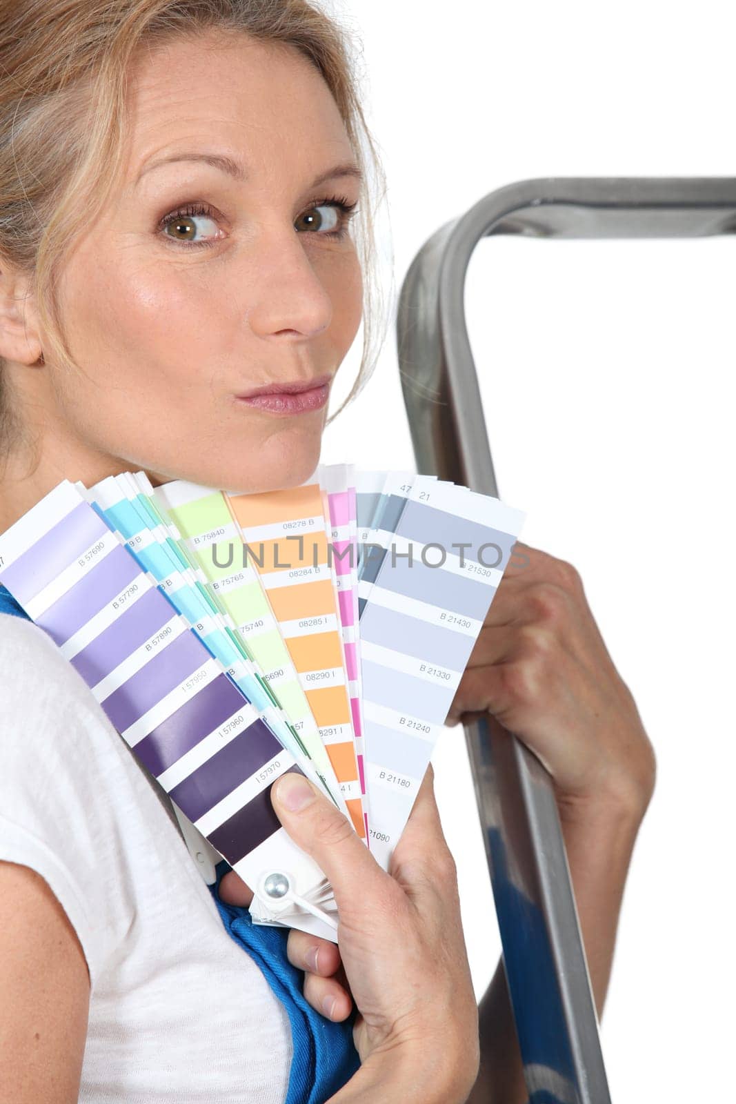 Woman holding paint swatches