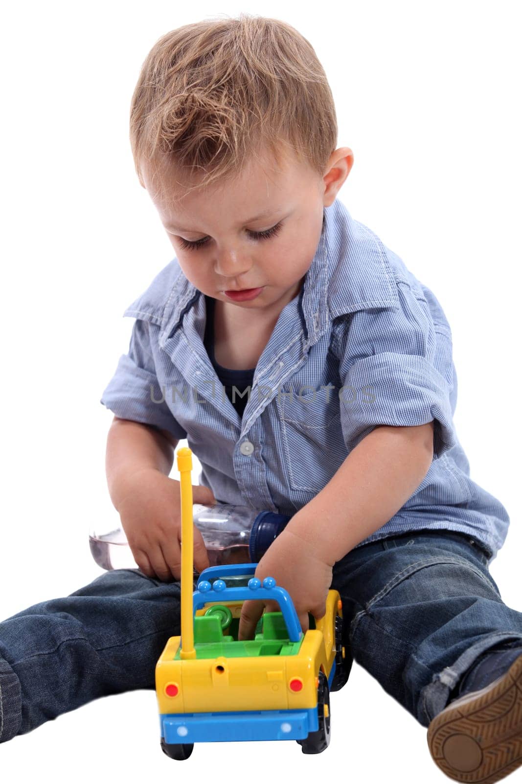 Baby playing with car