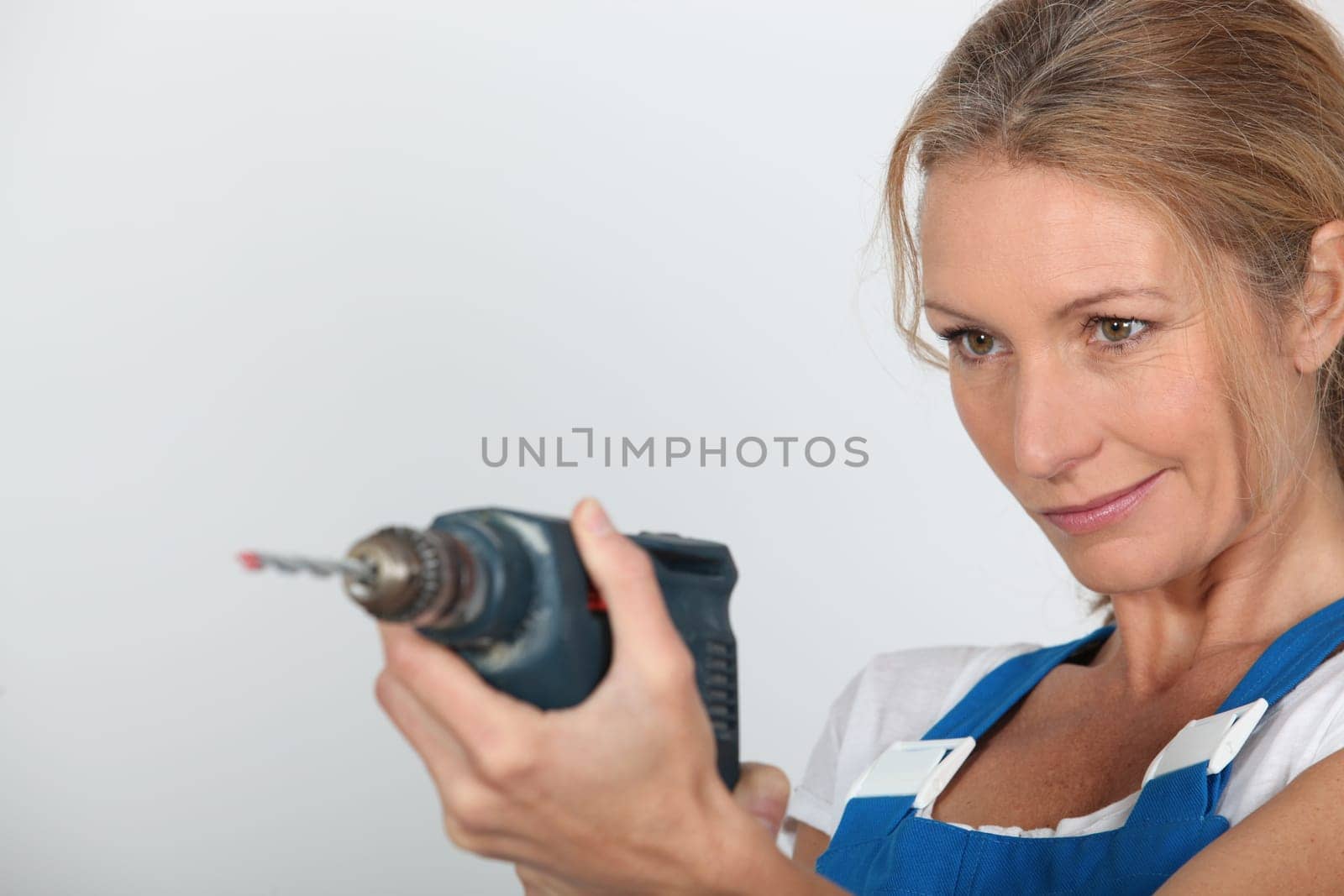 Women holding electric drill