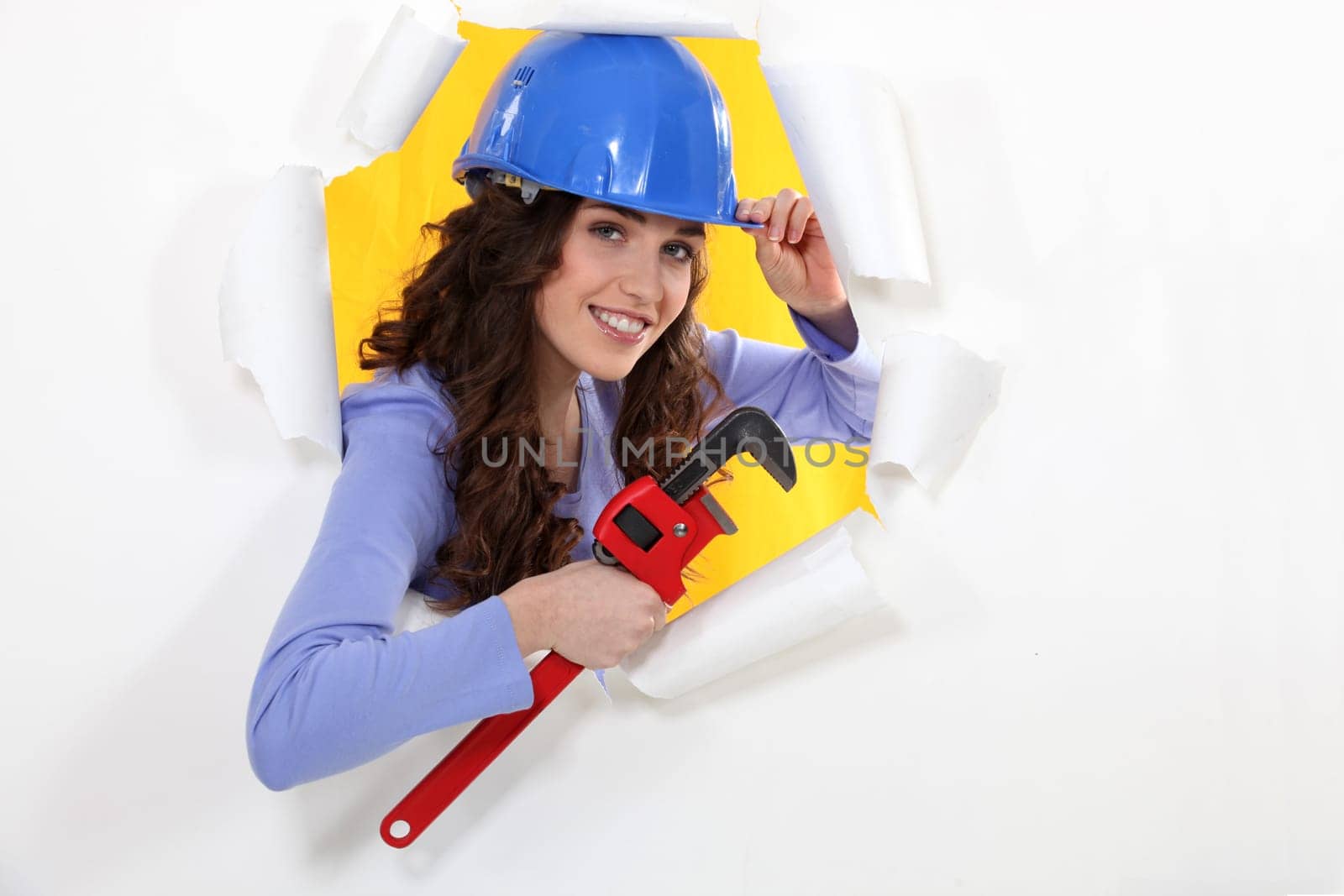 female worker watching us through a hole in a paper wall