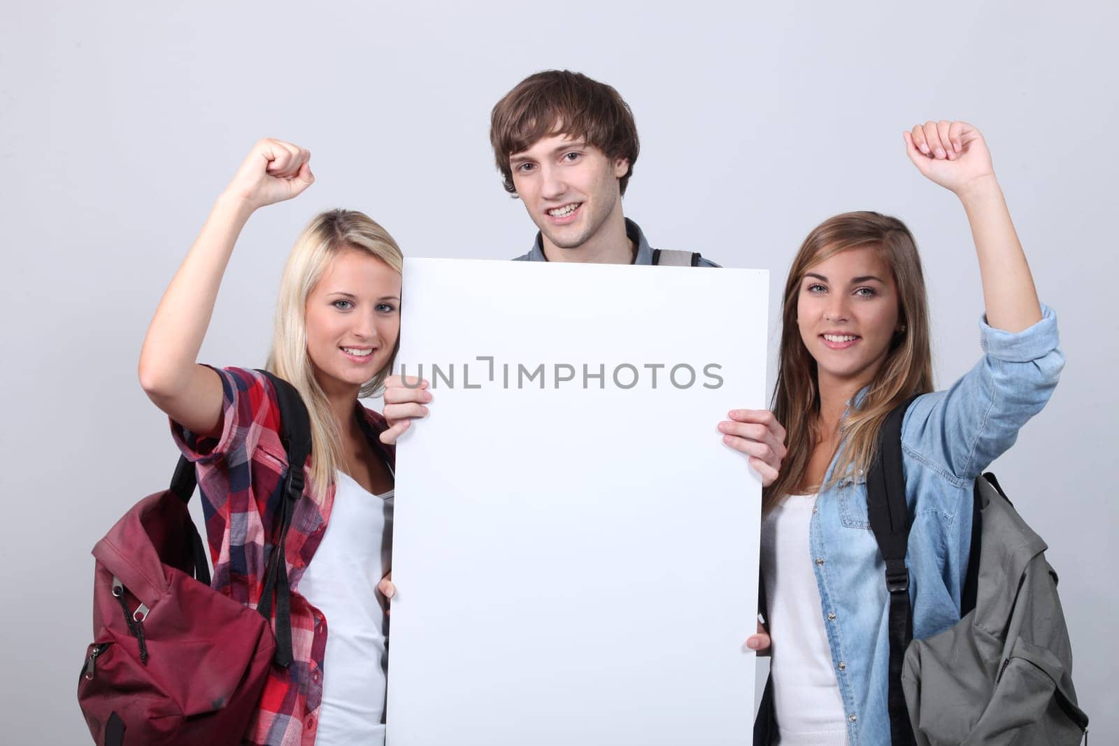Three teenagers with backpacks