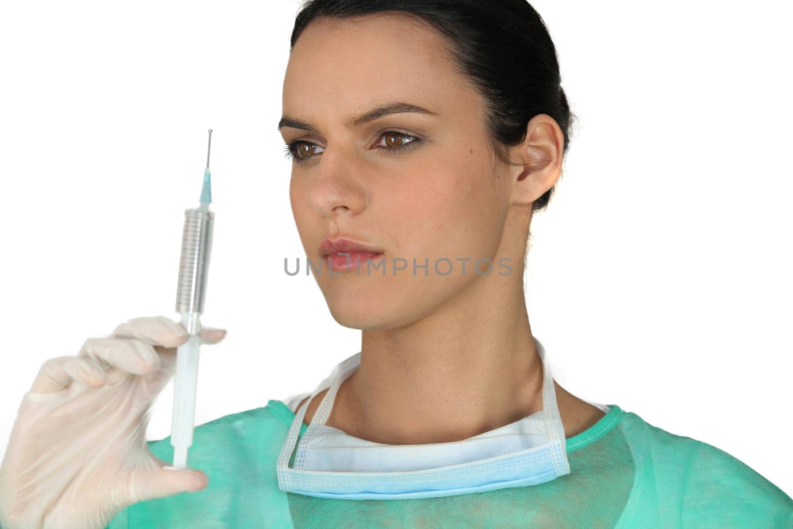 brunette nurse with hazel eyes holding syringe