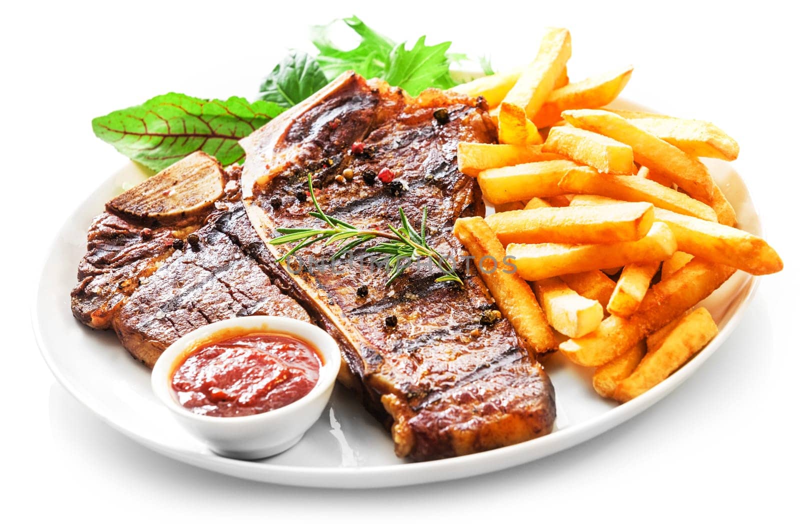 Tender grilled porterhouse or t-bone steak served with crisp golden French fries and fresh green herb salad accompanied by a BBQ or tomato ketchup sauce