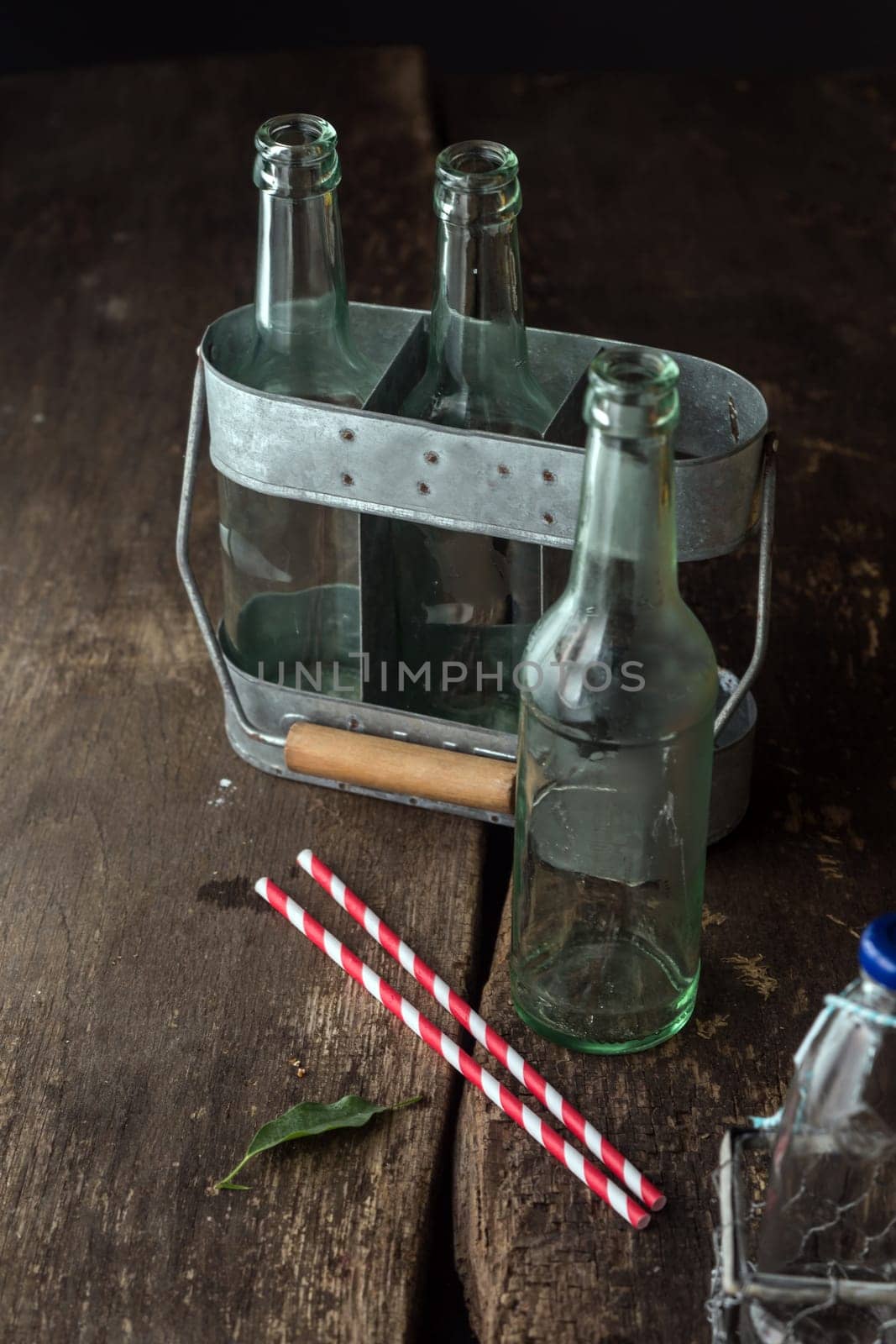 Empty Bottles in Tray Ready to Use for Any Liquids on Brown Wooden Table