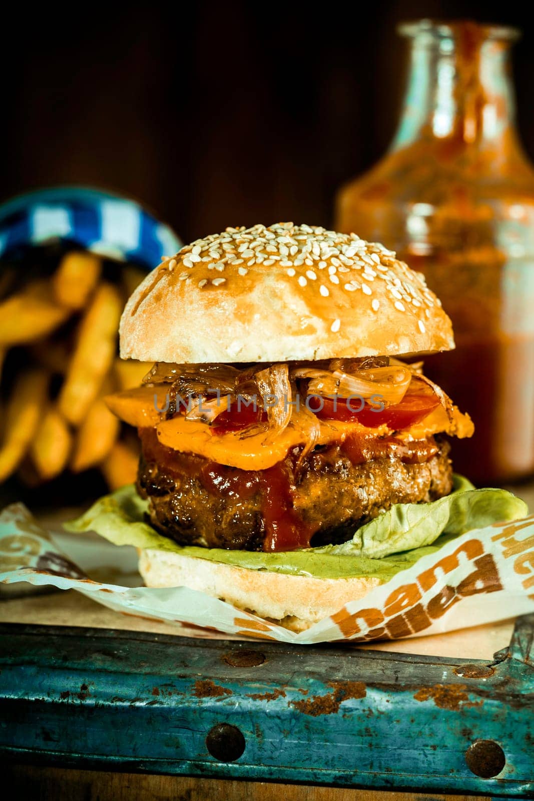 Macro Mouth Watering Handmade Burger Quarter Pounder with Frech Fries in Rustic Style.