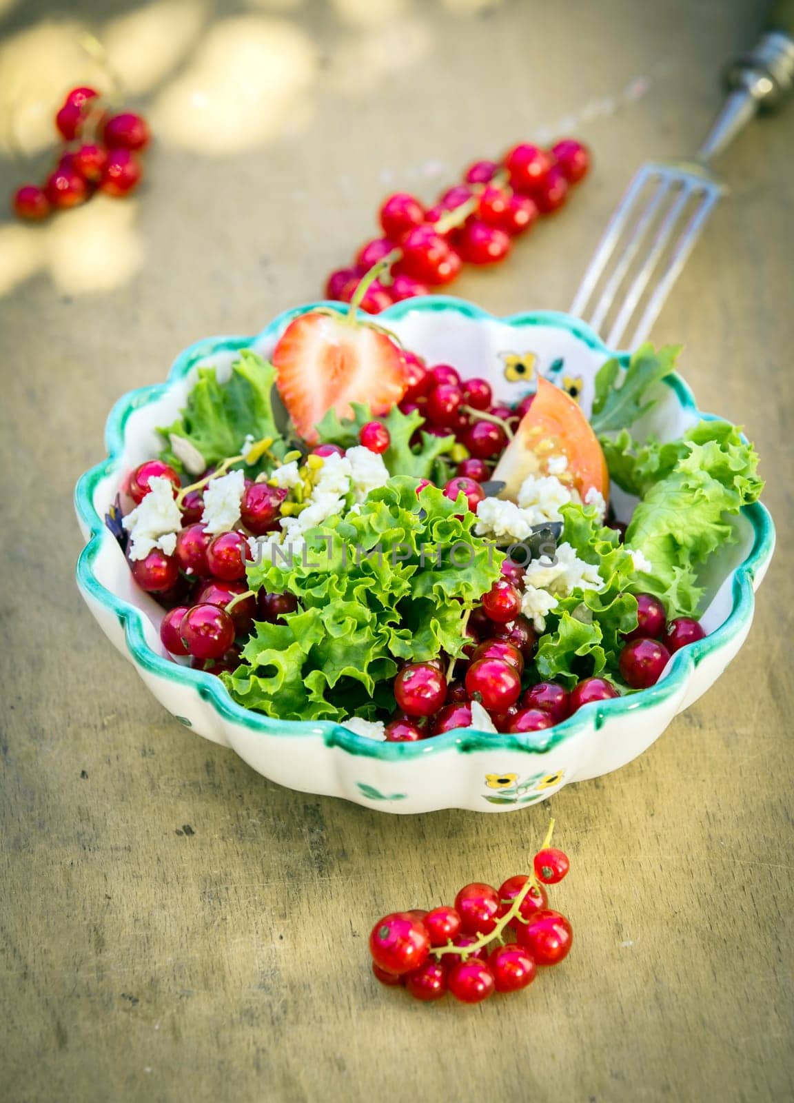 Appetizing Fresh Summer Salad in Bowl on Wooden Background. Good for Vegetarians.