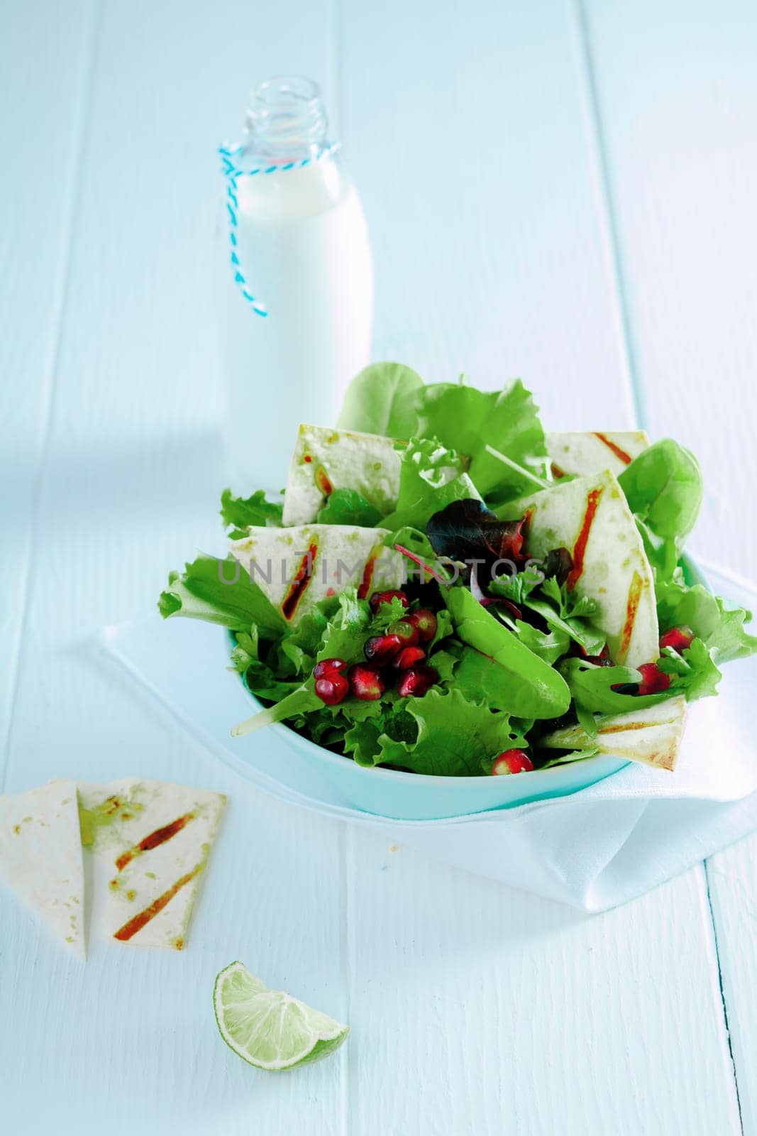 Gourmet Tasty Fresh Green Salad with Milk on White Wooden Table
