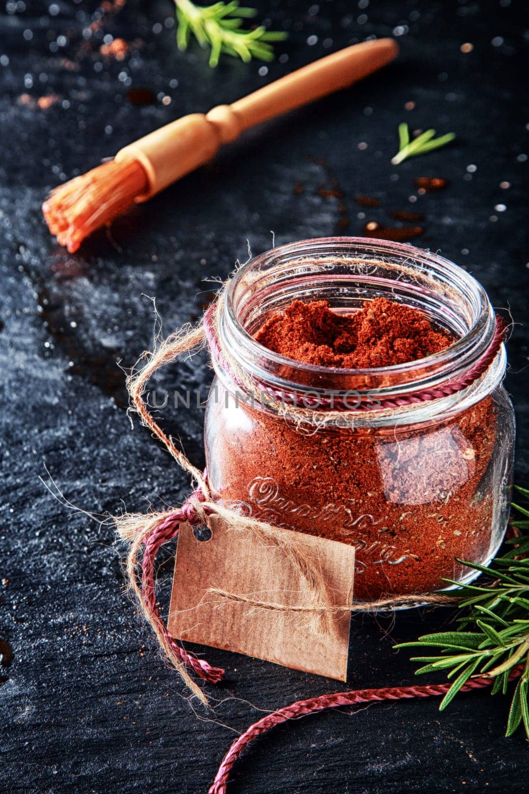 Macro Marinade Powder Container with Small Brush on Vintage Table. Used in Adding Meat Flavors.