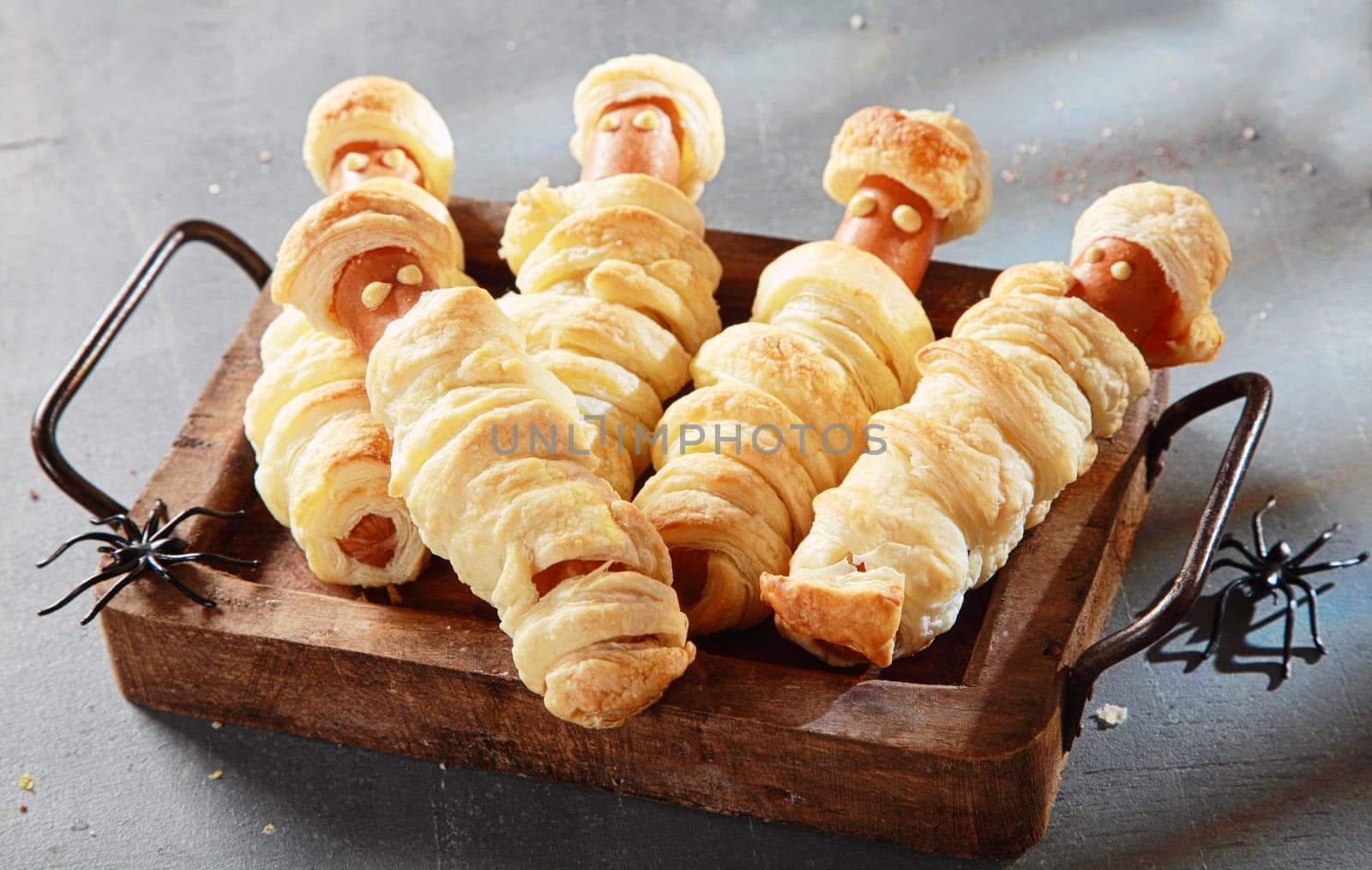Five Weiner Mummies Wrapped in Pastry on Tray for Halloween Party Appetizers