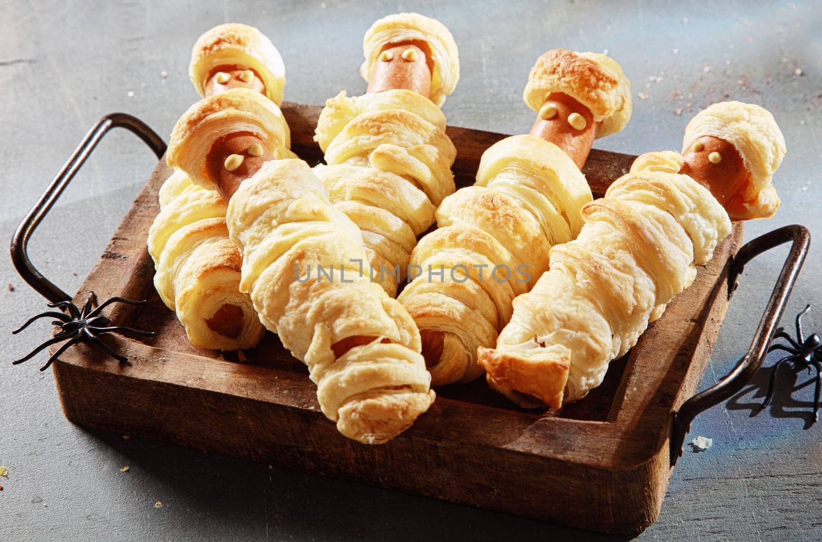 Five Weiner Mummies Wrapped in Pastry on Tray for Halloween Party Appetizer