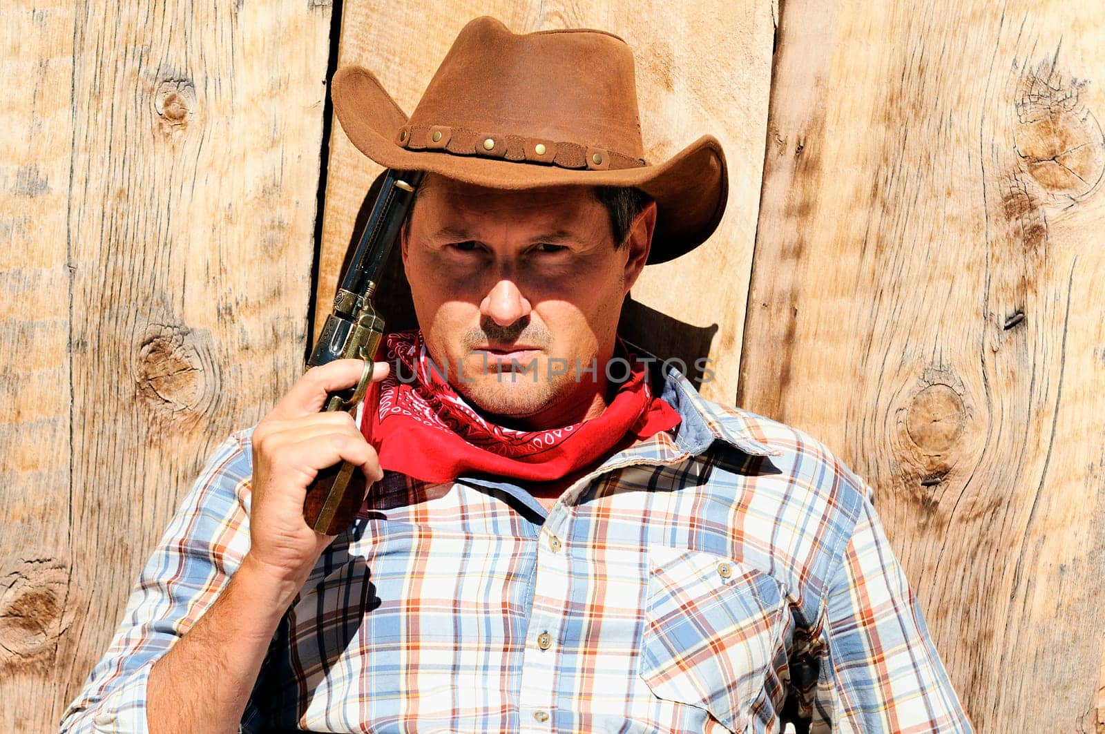 OUT WEST - A cowboy takes time to rest and reflect.
