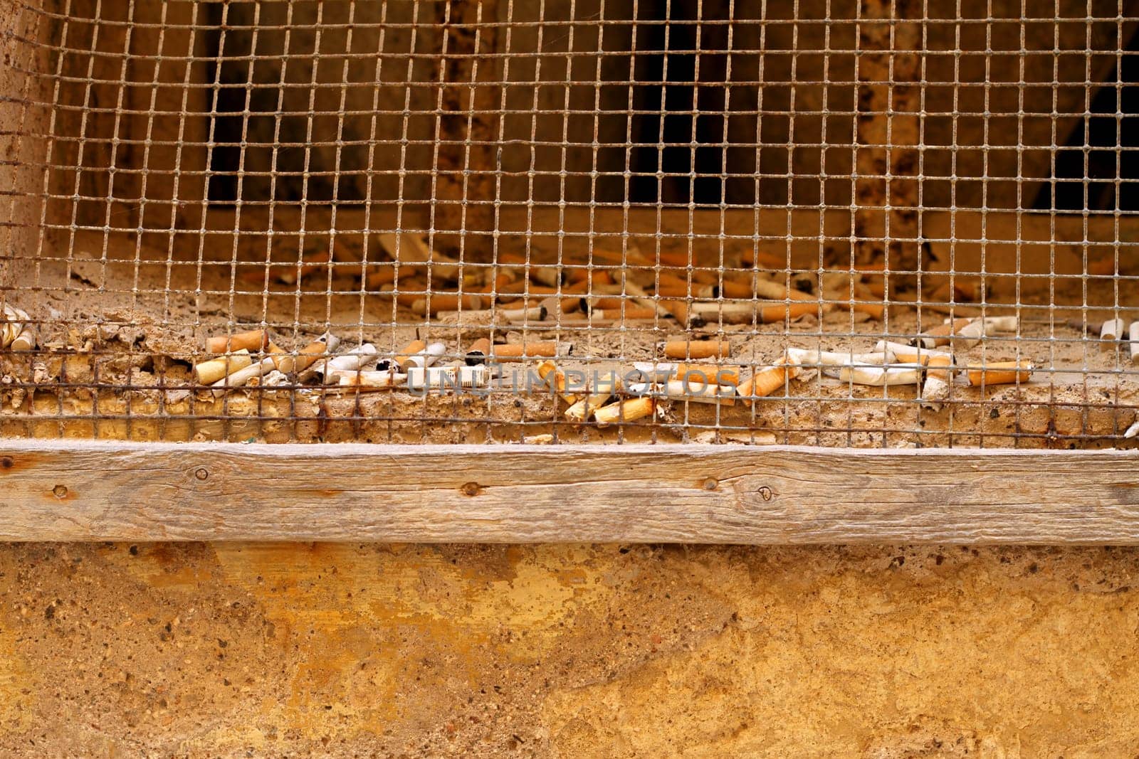 Small window full of butts.