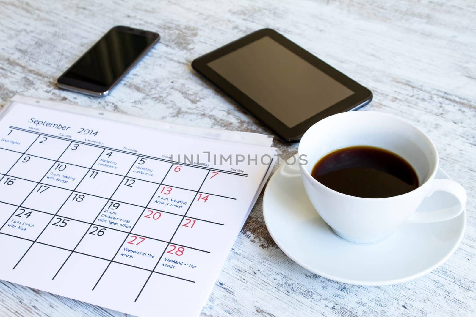 Checking monthly activities and appointments at the office.